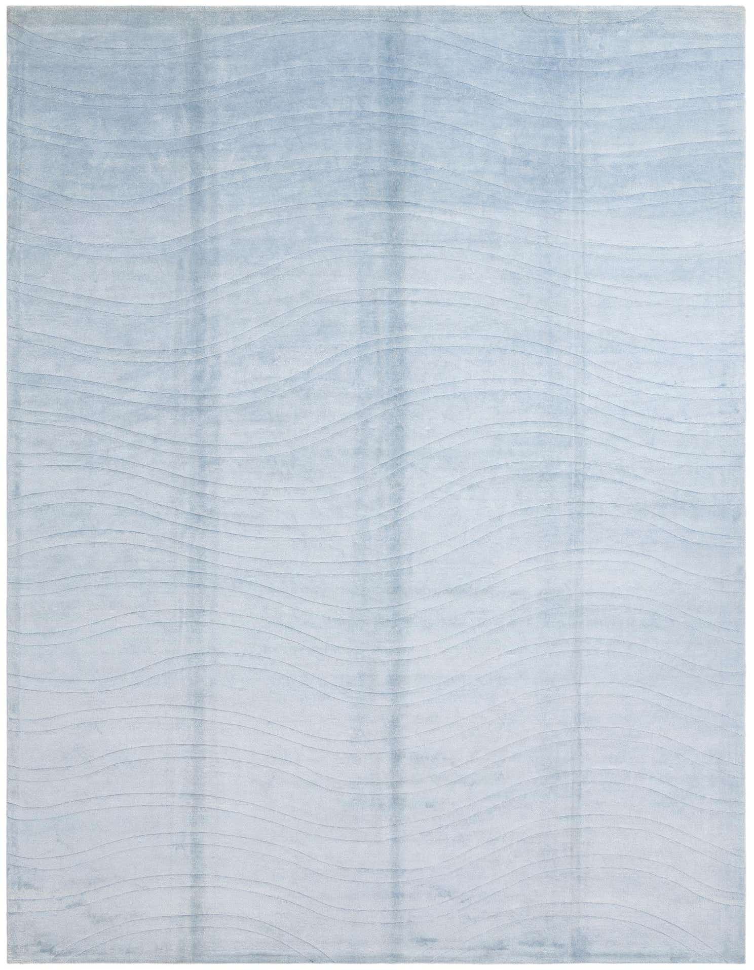 A 10x13 rectangular light blue wool rug with a subtle modern wave pattern, suitable for a living room.