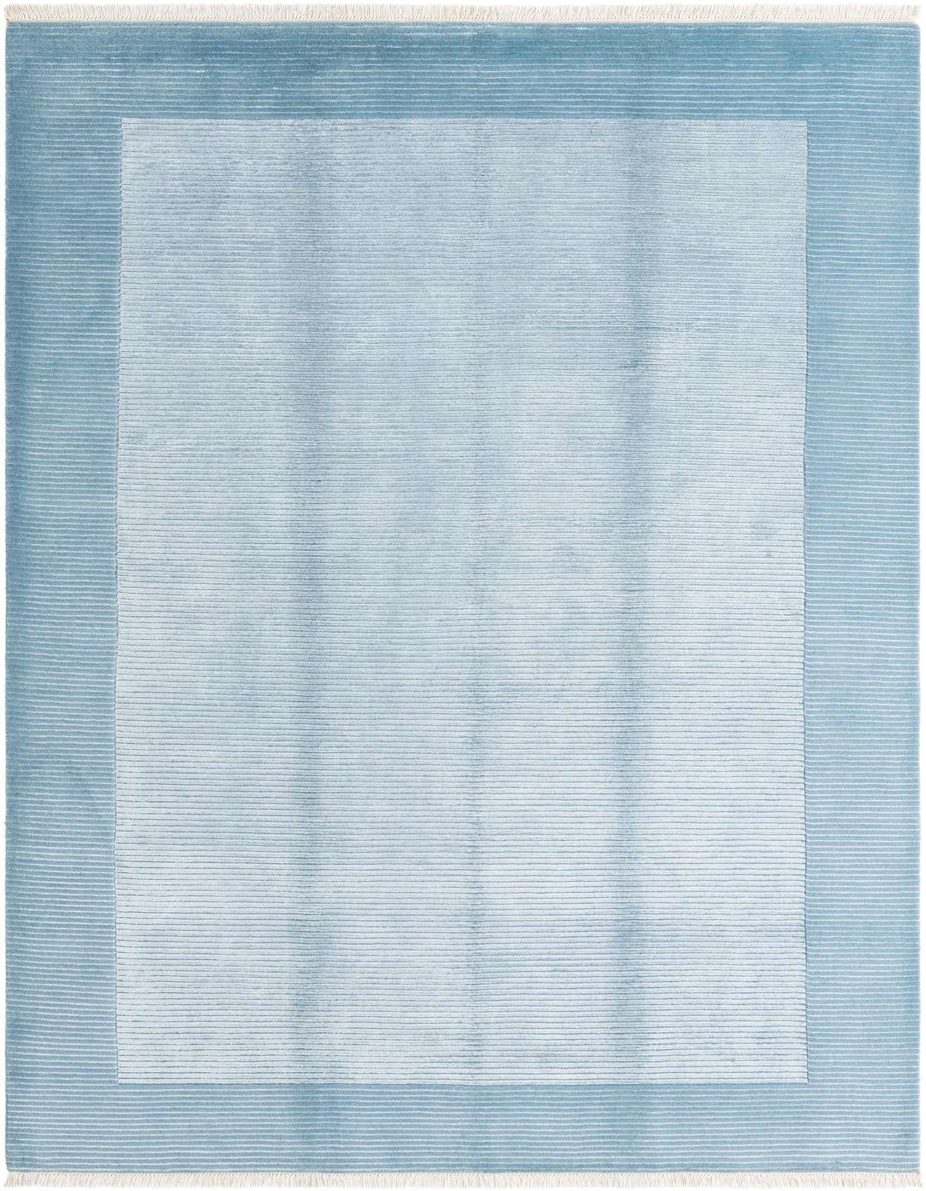 A 7x10 rectangular Darya rug in light blue, featuring a modern striped border and a solid light blue center.