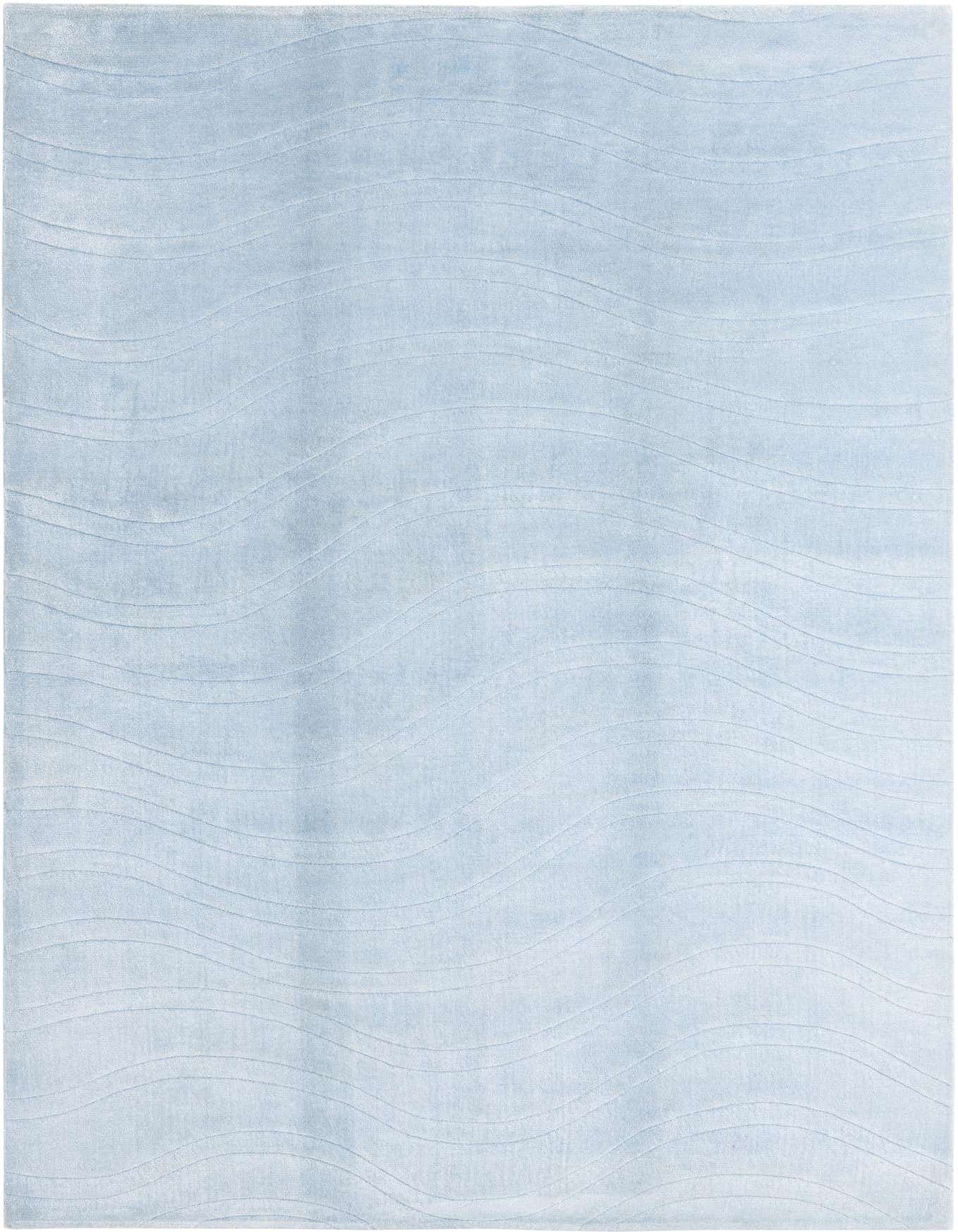 A 7x10 rectangular light blue wool rug with a subtle wavy modern pattern, suitable for a living room.