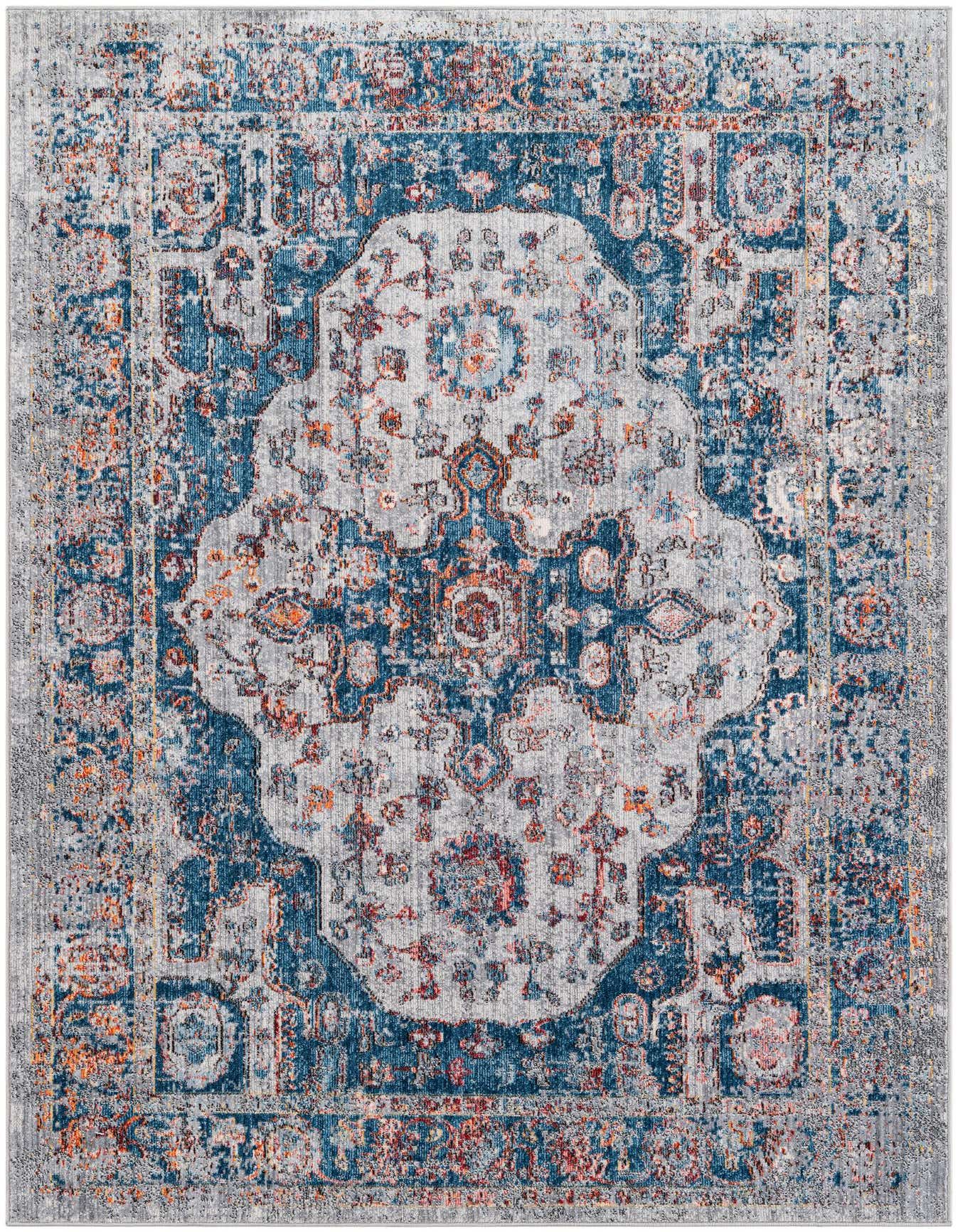 A 5x8 rectangular Fleur rug featuring a distressed vintage medallion pattern in shades of blue, gray, and hints of orange.