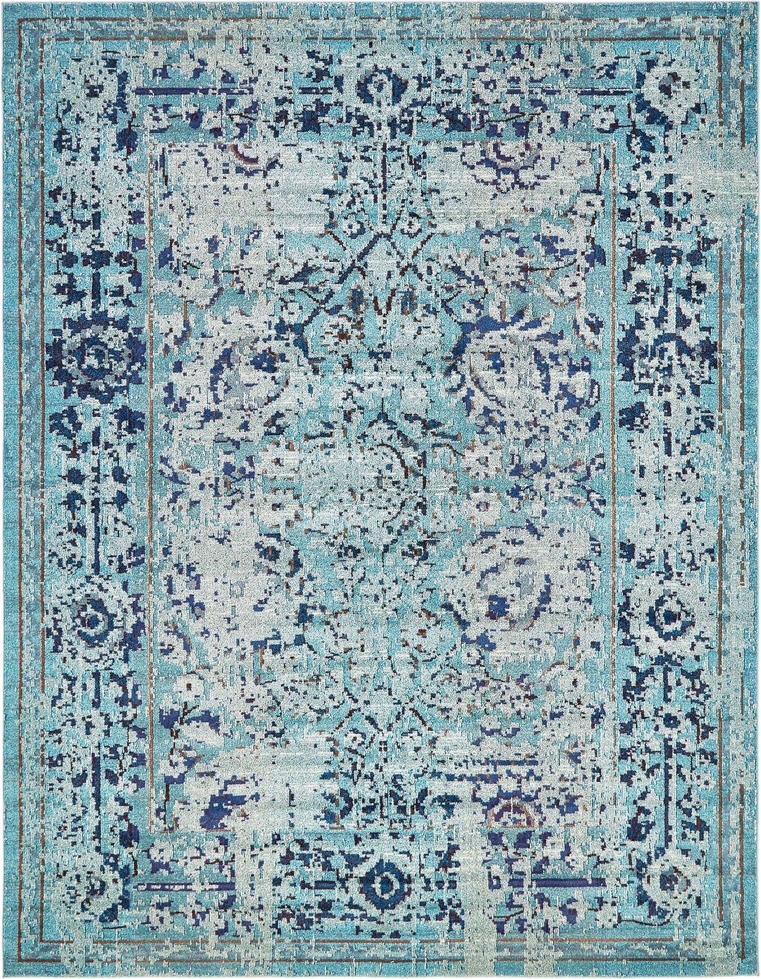 A 10x13 rectangular light blue and dark blue Bohemian rug with a distressed floral and medallion pattern.