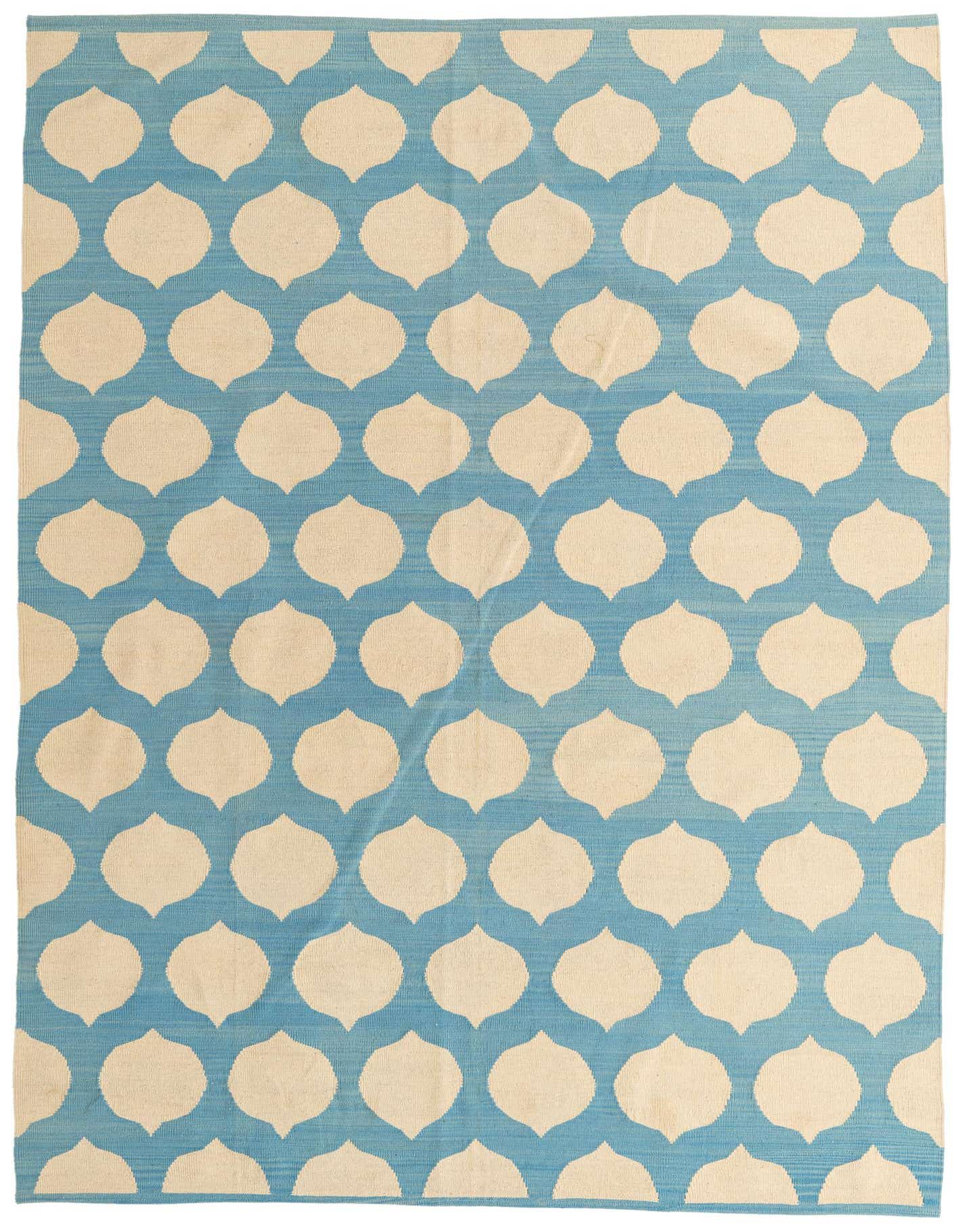 A 7x10 rectangular flatweave rug featuring a light blue background with repeating cream-colored tribal ogee patterns.