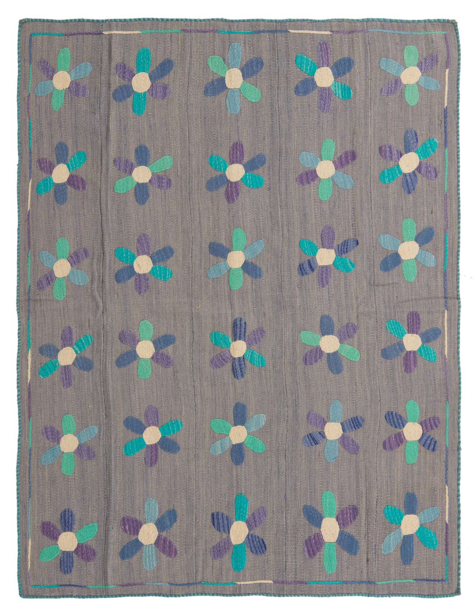 A 5x8 rectangular Kilim Suzani rug featuring a light blue background with colorful floral patterns in shades of blue, teal, and purple.