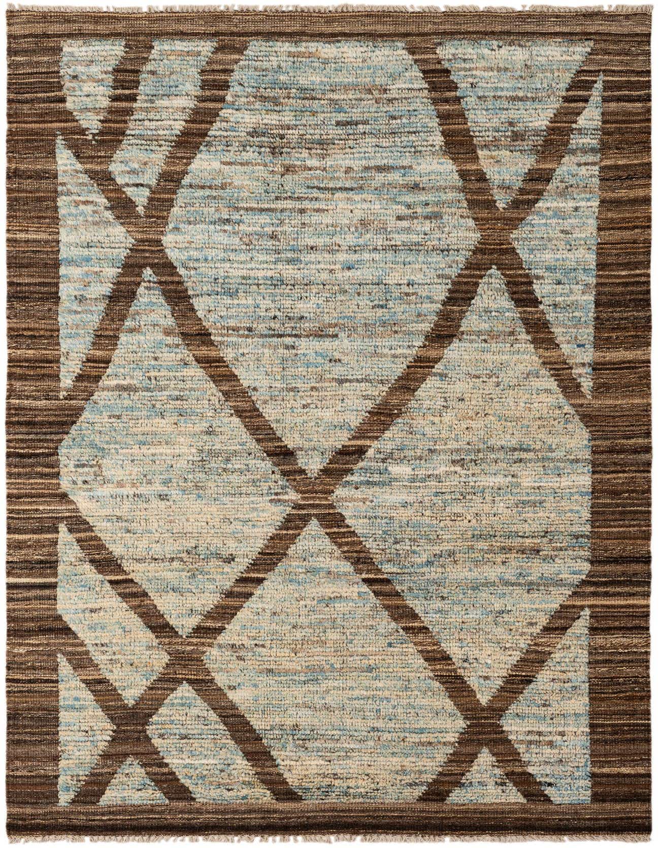 A 4x6 rectangular Moroccan tribal rug with a light blue and beige field, featuring a bold brown geometric pattern.