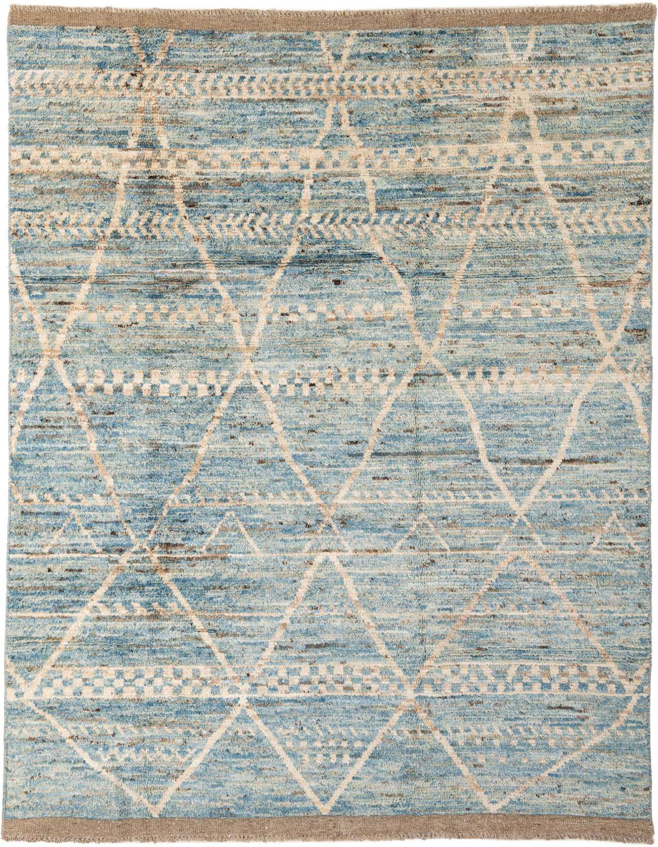 A 6x9 rectangular light blue wool rug with a tribal diamond pattern and subtle brown accents, suitable for a living room.