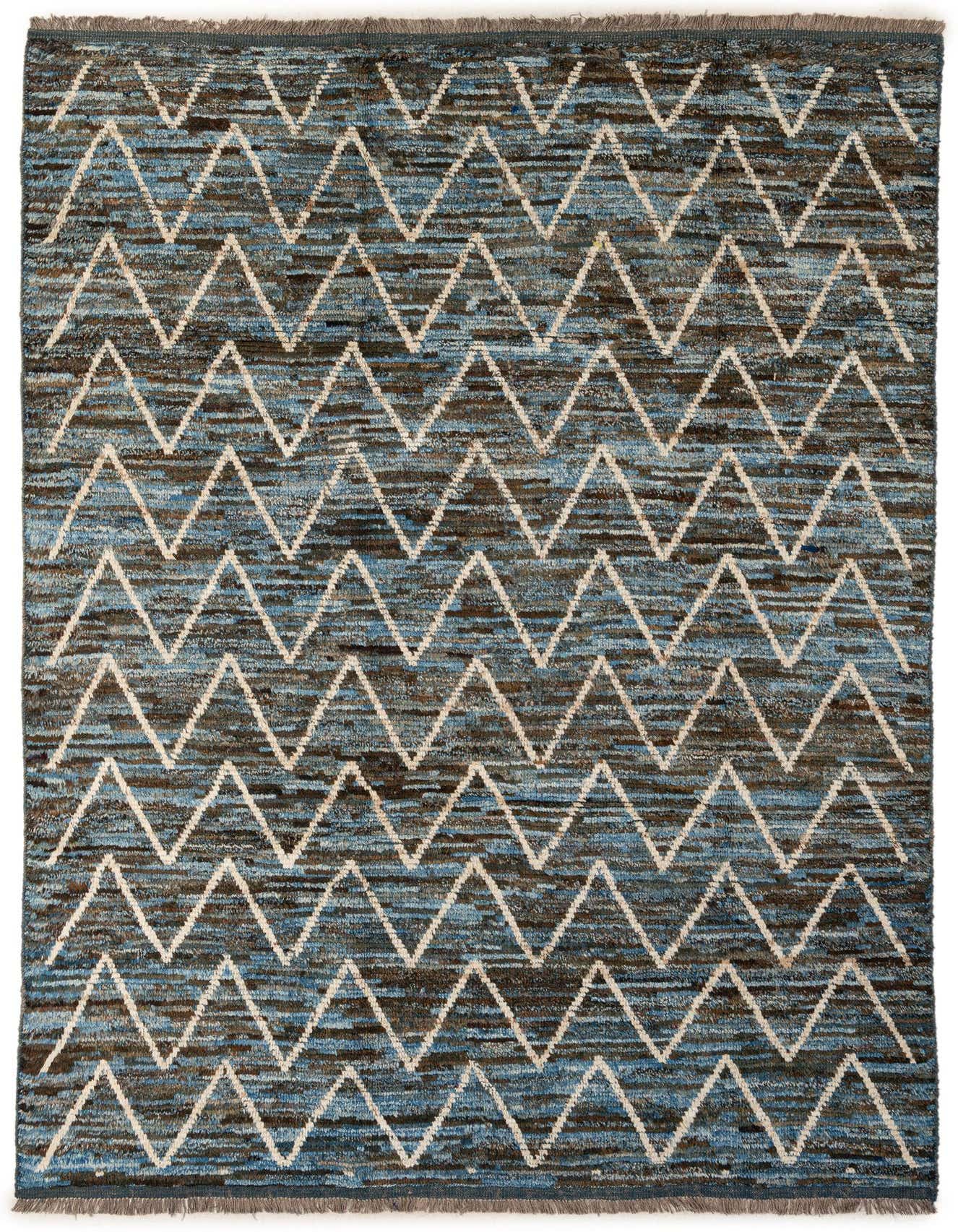 A 7x10 rectangular Moroccan wool rug featuring a repeating light blue and brown chevron pattern on a textured background.