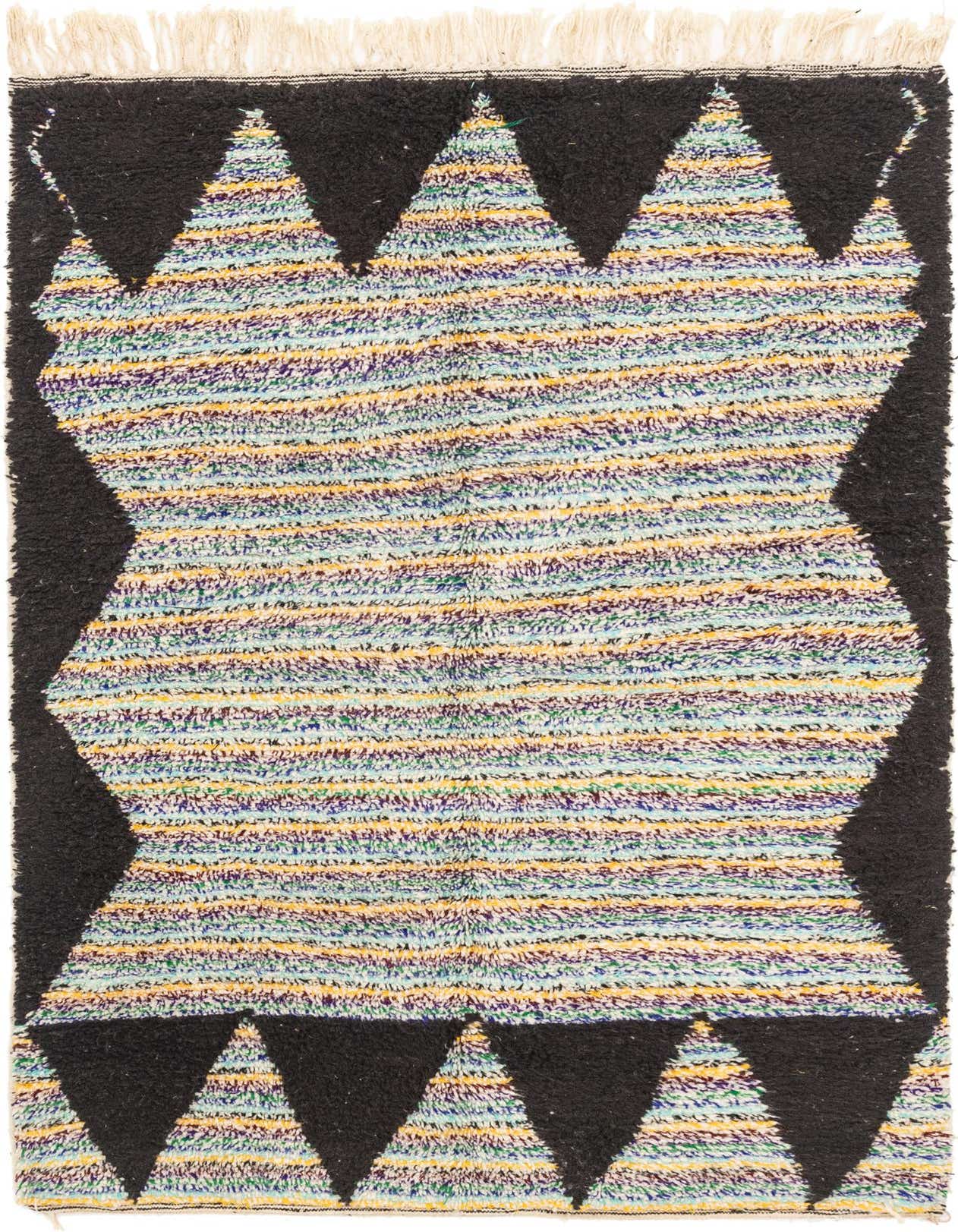 A 5x8 rectangular light blue shag rug with a modern tribal stripe pattern and black geometric borders, featuring fringe.