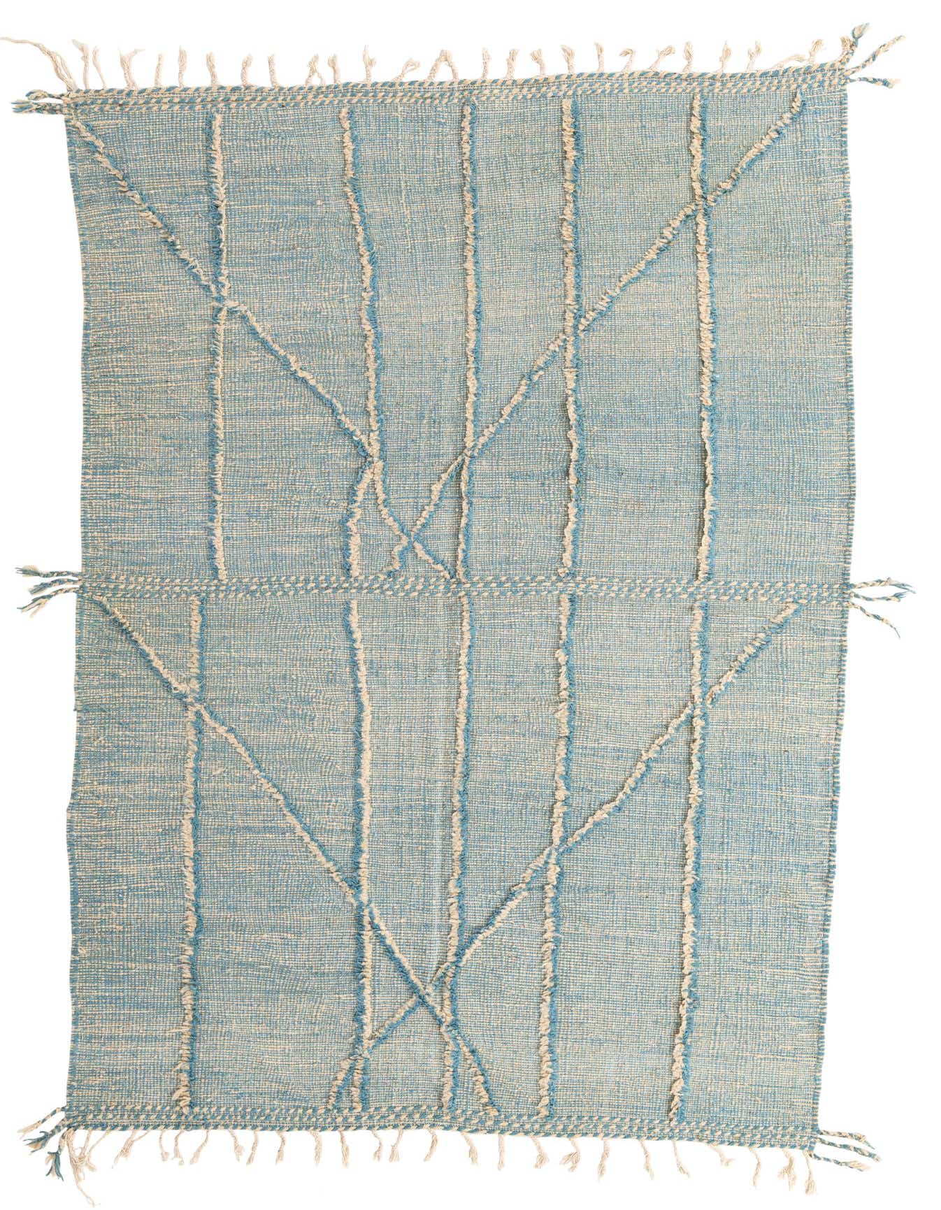 A 6x9 rectangular light blue wool shag rug with a modern tribal pattern and fringe.