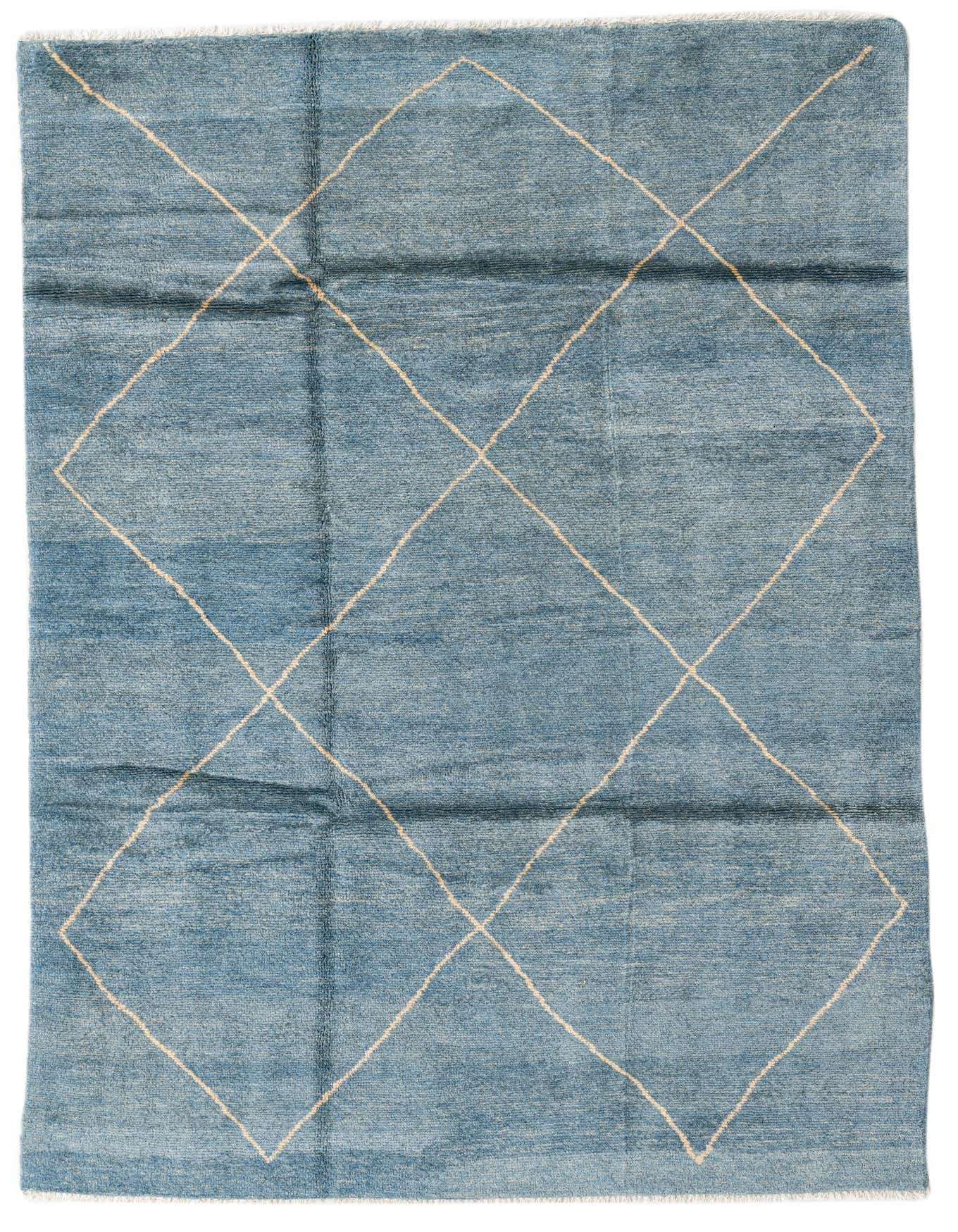 A 5x8 rectangular light blue Moroccan shag rug with a cream diamond tribal pattern, ideal for a living room.