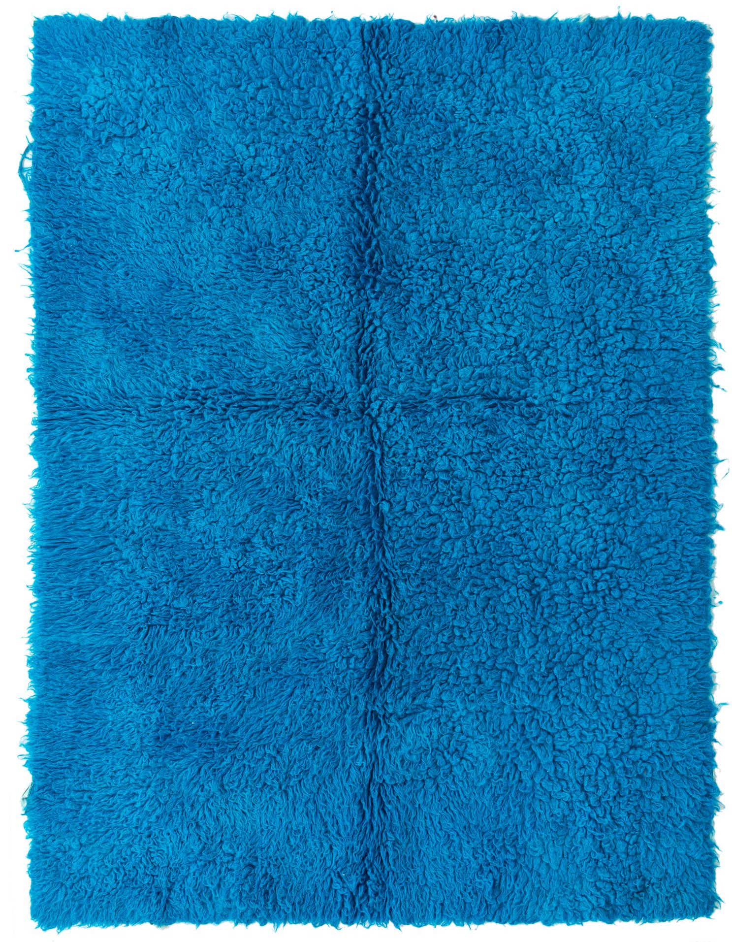 A vibrant 4x6 rectangular shag rug in a bright blue color, featuring a plush, textured pile.