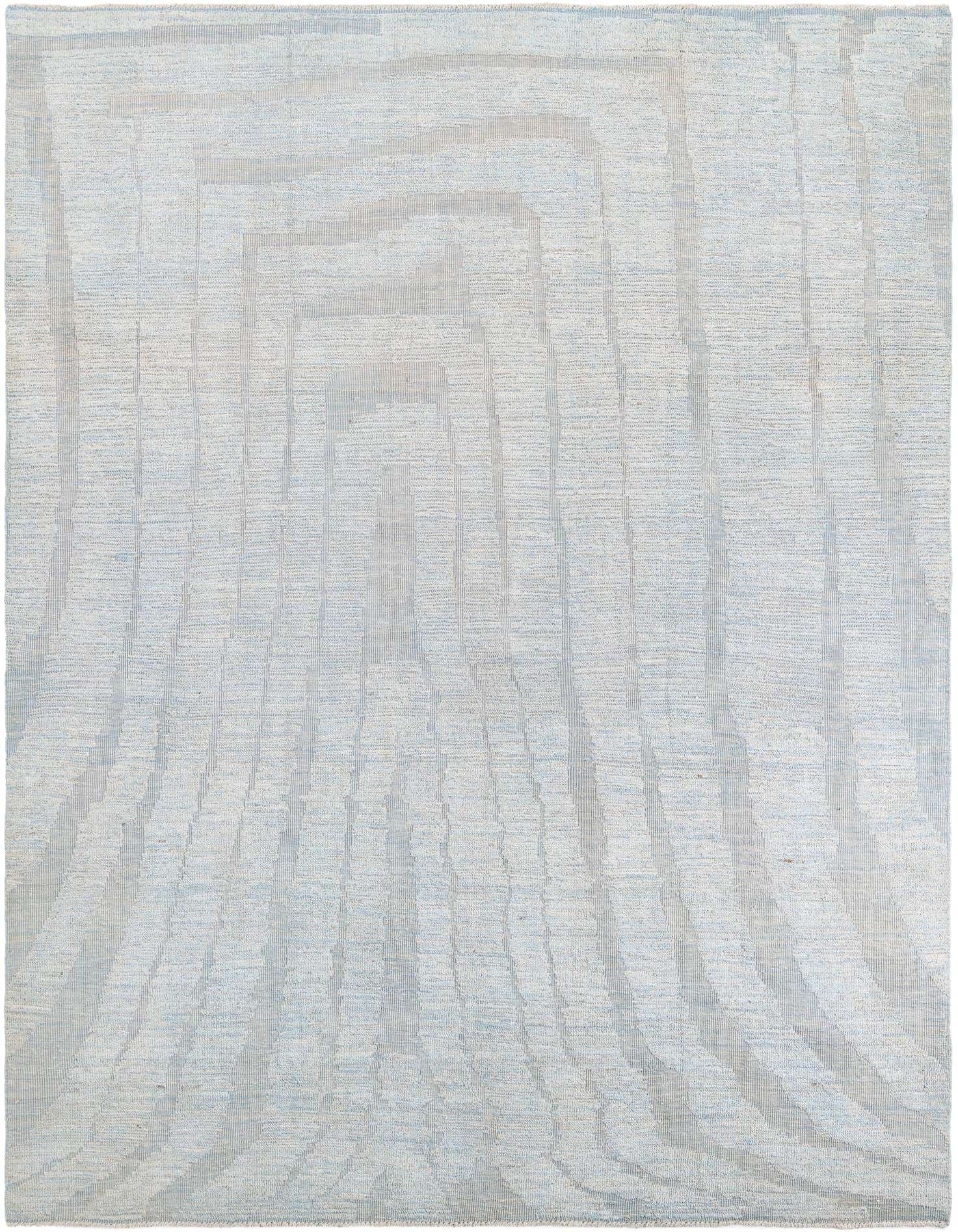 A 9x12 rectangular light blue shag rug with a subtle tribal abstract pattern, suitable for a living room.
