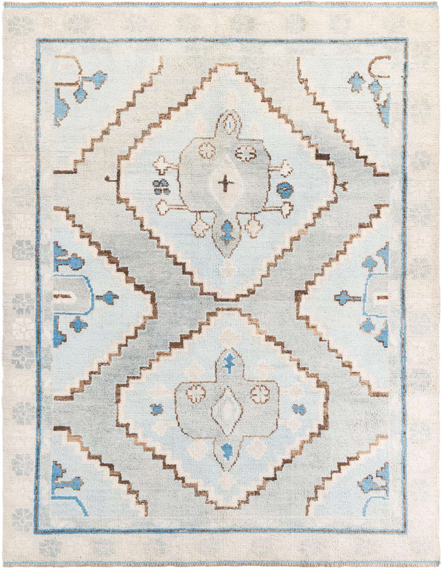 A 7x10 rectangular light blue Moroccan shag rug with a central medallion and tribal patterns, perfect for a living room.