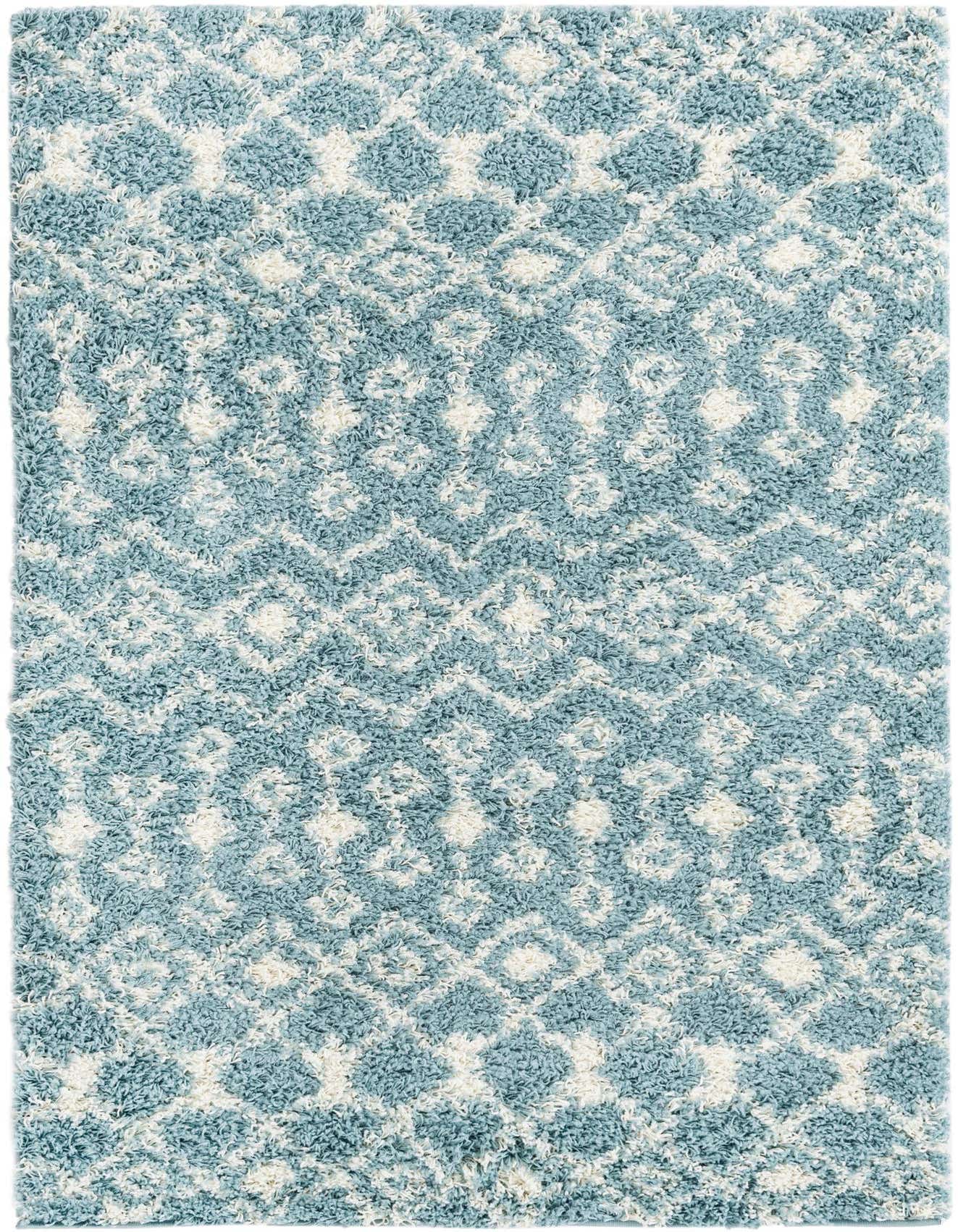 A 4x6 rectangular light blue and white shag rug with a modern tribal trellis pattern.