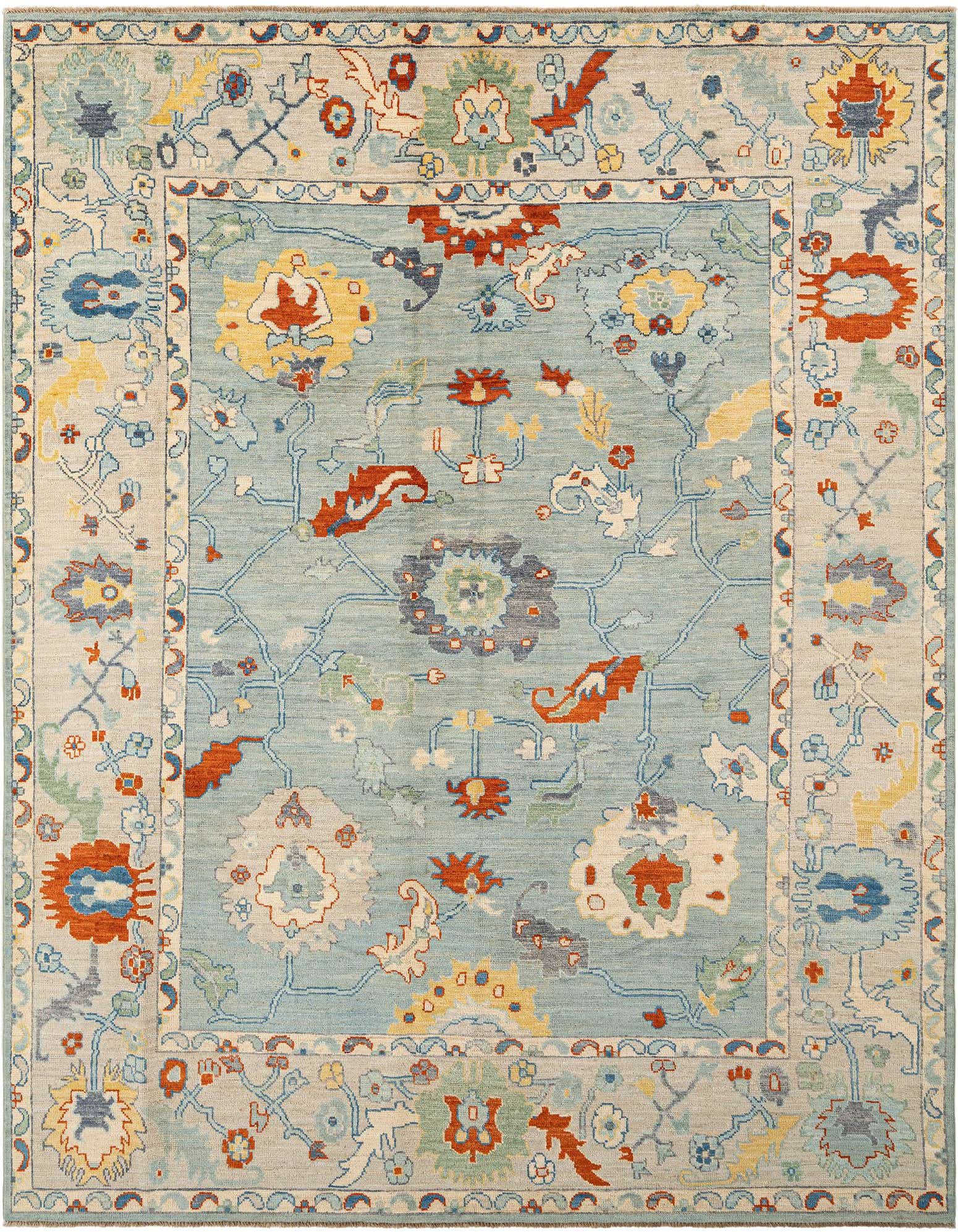 Handmade rectangular Oushak rug featuring a light blue field with intricate Persian floral and vine patterns in blues, reds, yellows, and creams, framed by a patterned border.