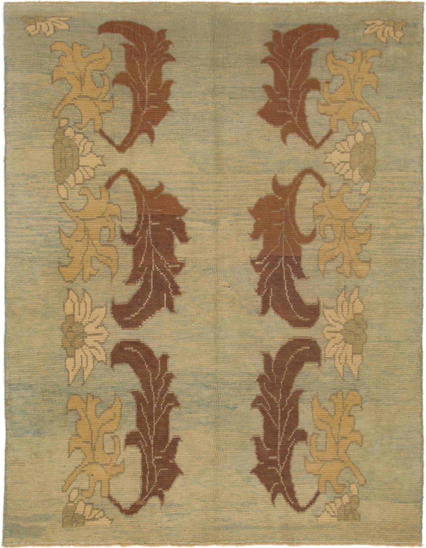 A 6x9 rectangular Oushak rug in light blue with traditional tribal patterns in brown, gold, and cream.