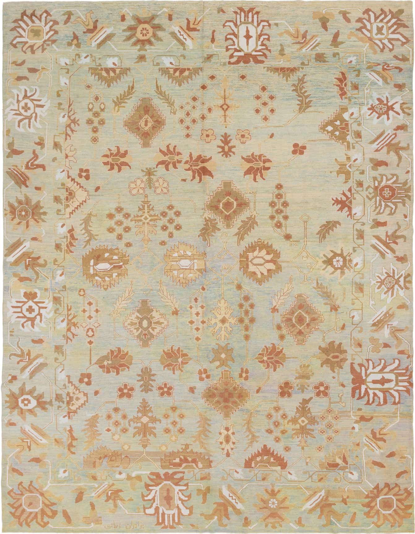 A large 13x18 rectangular Oushak rug in light blue with transitional, Southwestern, and tribal patterns in terracotta, gold, and cream.