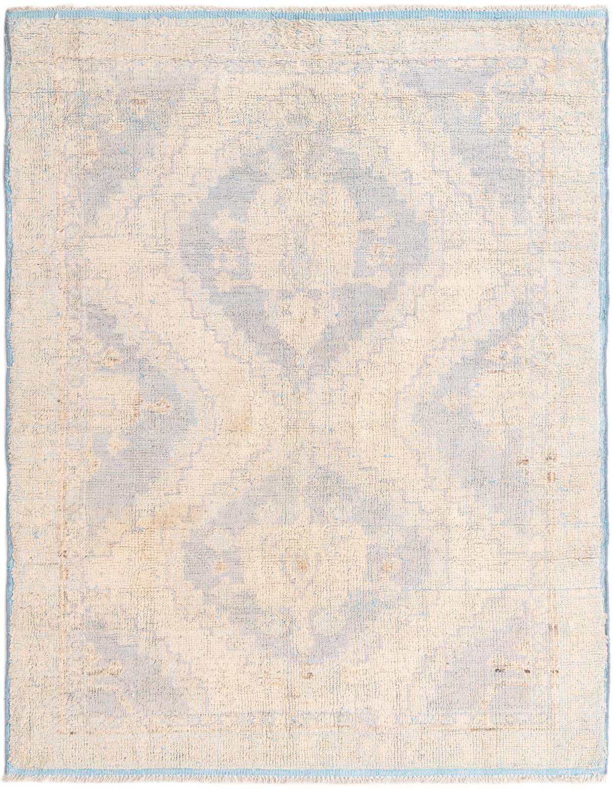 A 6x9 rectangular Oushak rug in light blue and cream, featuring a subtle modern pattern with a medium pile.