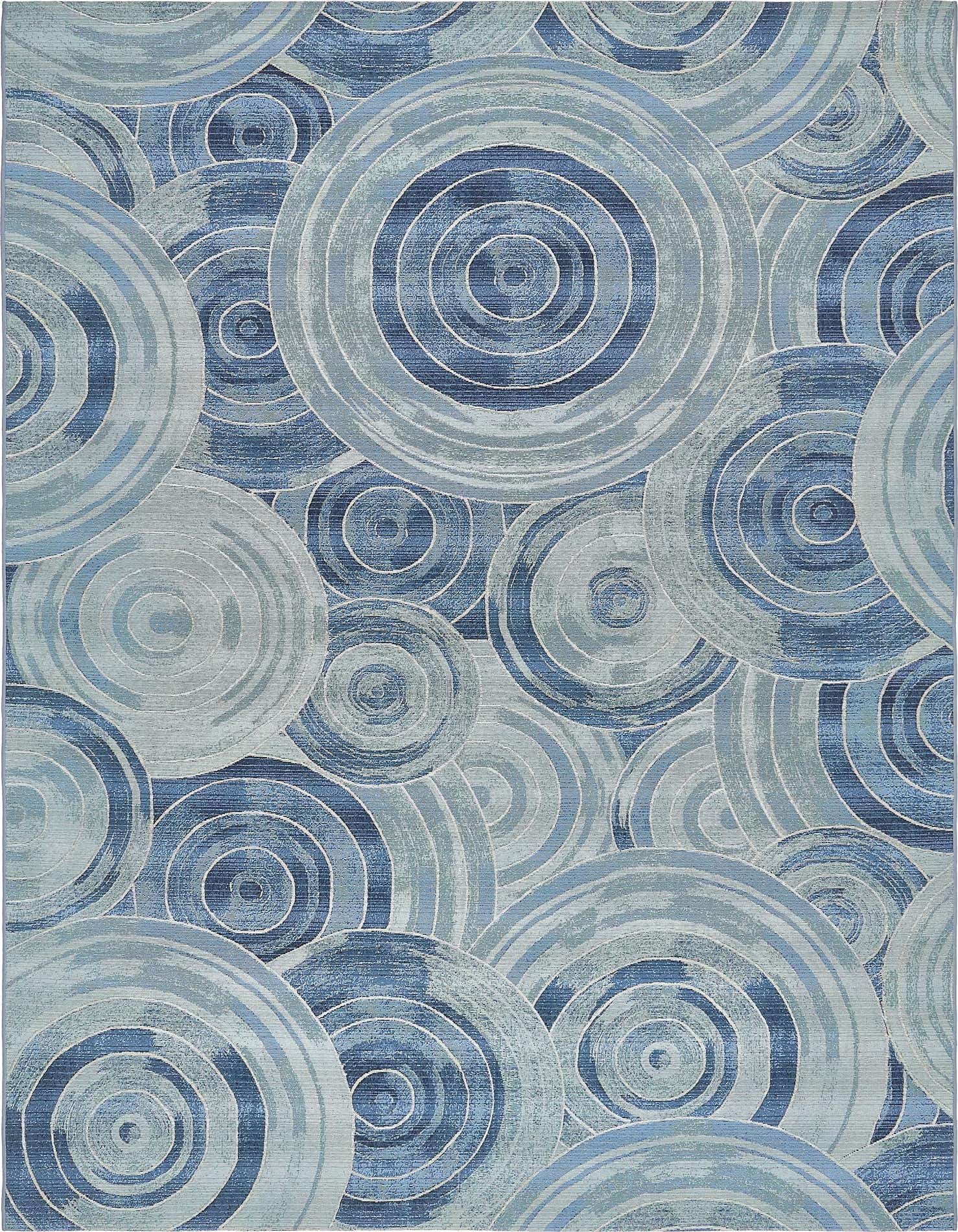 An 8x11 rectangular indoor/outdoor rug featuring an abstract coastal pattern of overlapping blue and light blue concentric circles.