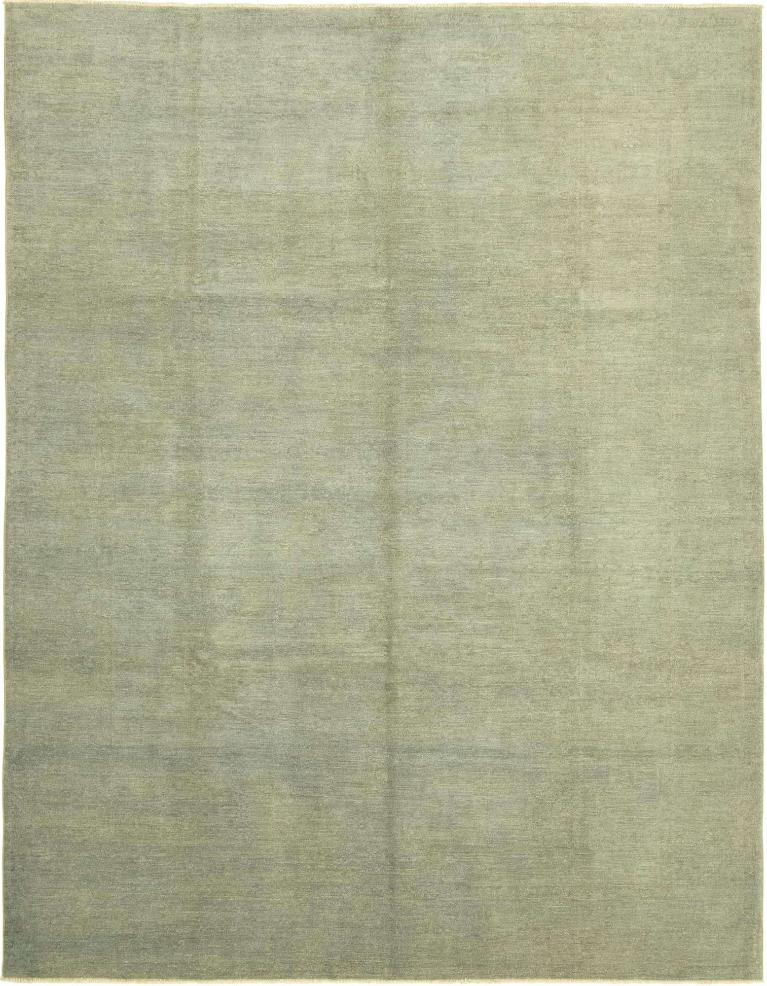 A 9x12 rectangular light blue traditional area rug made of hand-spun wool with a subtle, distressed pattern.