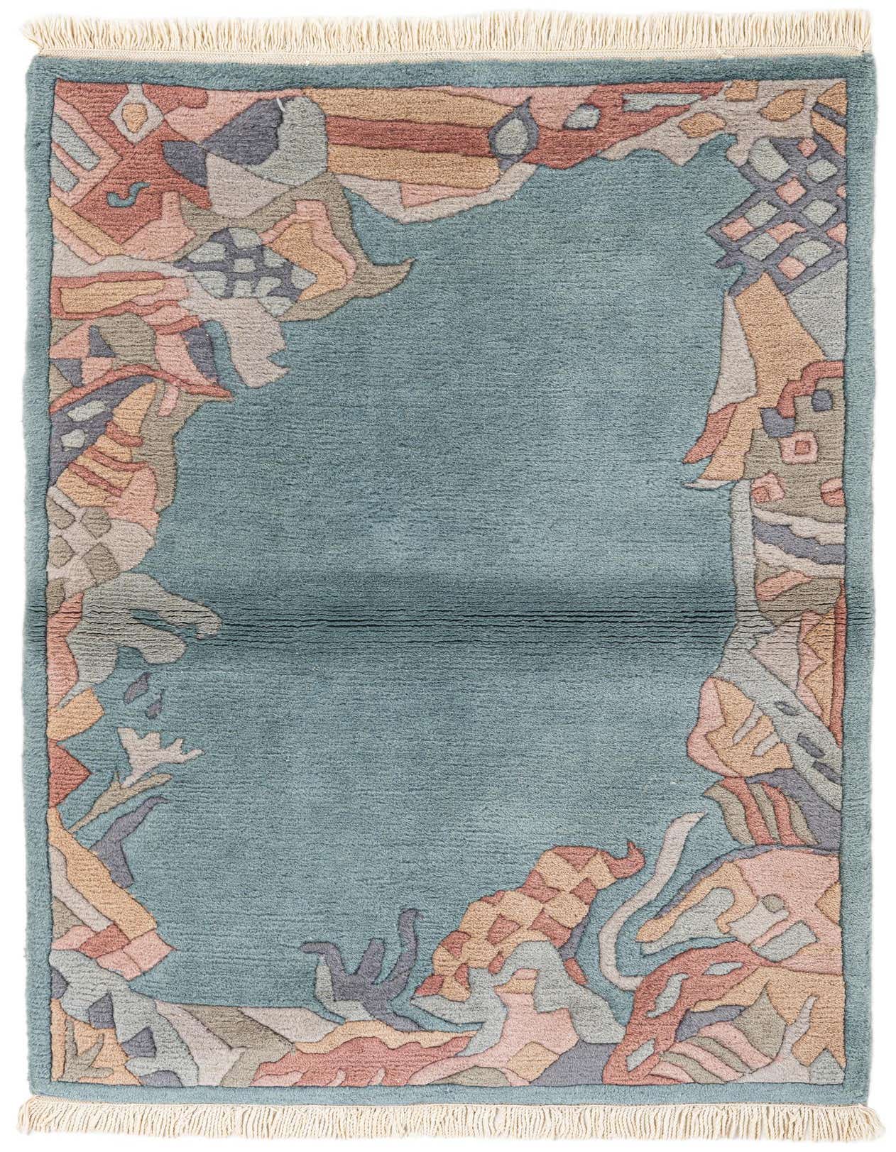 A 3x5 rectangular light blue wool rug with an abstract, multicolored border in shades of pink, peach, grey, and teal, featuring a medium pile and fringe.