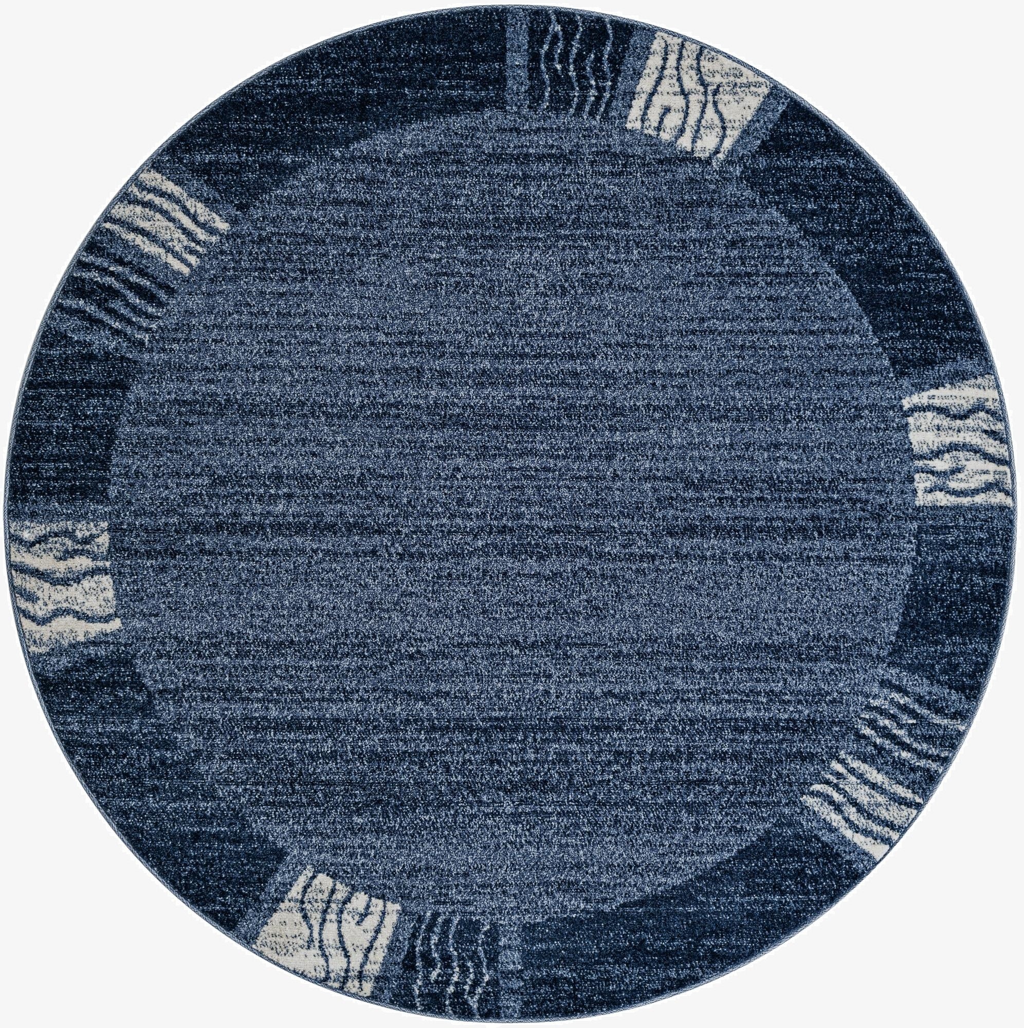 A 6' 0 x 6' 0 round blue rug with a contemporary coastal border featuring abstract wave patterns in lighter blue and white.