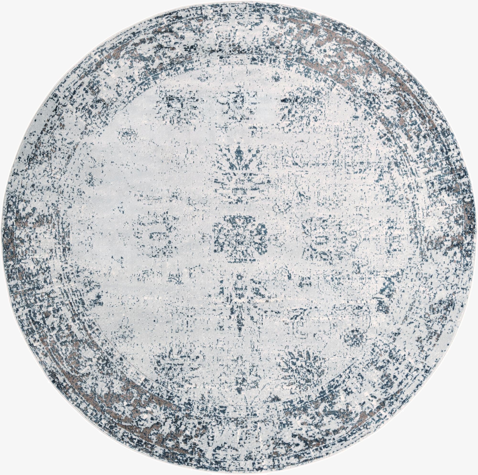A 10-foot round Monte Carlo rug from Rugs.com with a distressed light blue and white medallion pattern, ideal for indoor spaces.