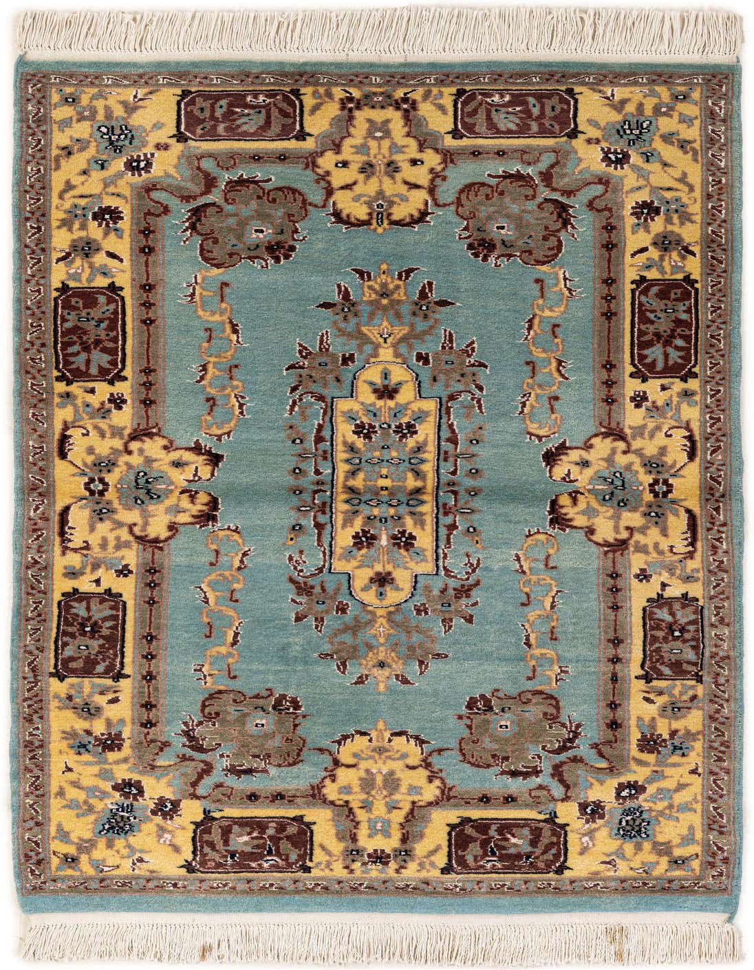 A 7 Ft Runner Bokhara rug in light blue with traditional tribal patterns in gold, brown, and cream, featuring a shag pile and fringe.