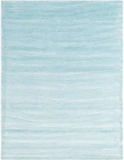 A light blue 13 ft runner rug with a subtle wavy, modern pattern, ideal for a hallway.