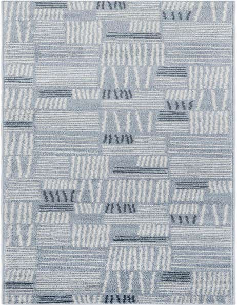 A 12 ft runner rug in light blue with a modern abstract pattern of white and dark blue dashes and lines.