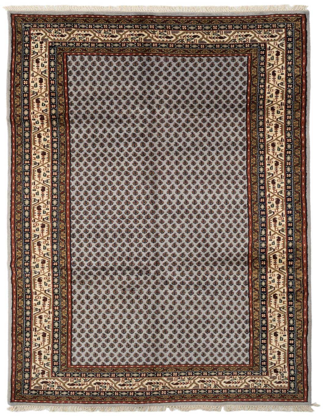 A handmade 10 Ft runner rug in light blue with a repeating brown and rust leaf pattern and a multi-border design, ideal for a hallway.