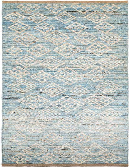 A light blue 16 ft runner rug with a tribal pattern of cream and brown diamonds, handmade from wool.