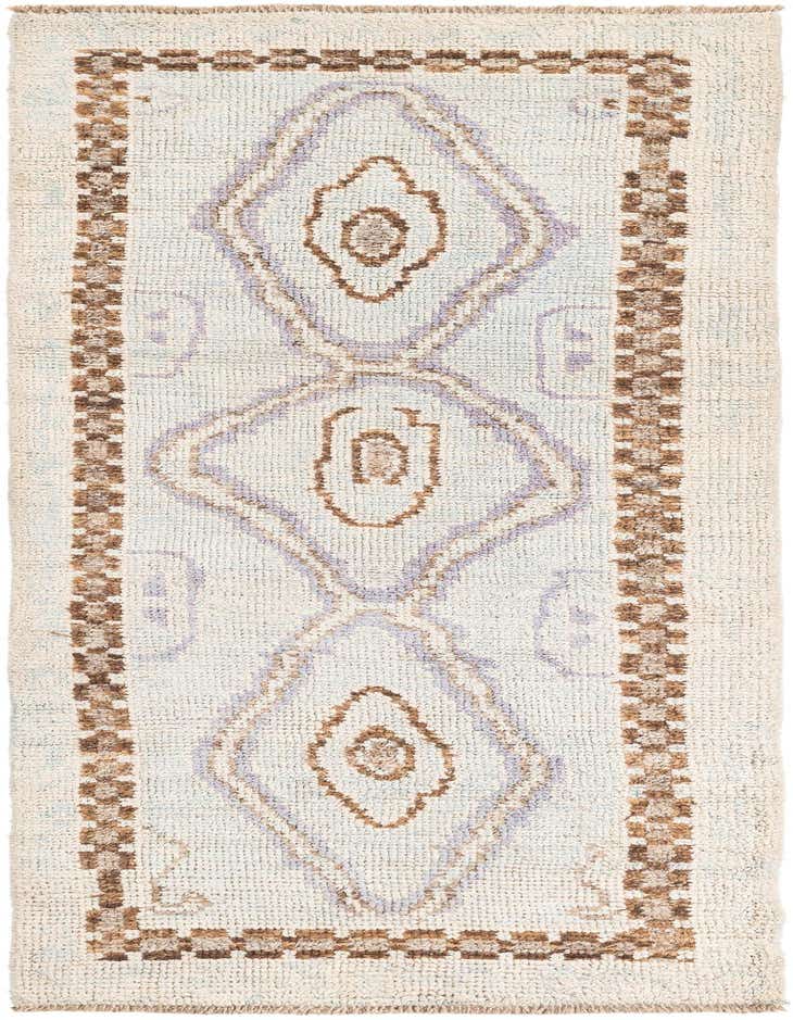 A handmade 8 ft Moroccan runner rug with a light blue shag pile and brown and lavender tribal diamond patterns, perfect for a hallway.