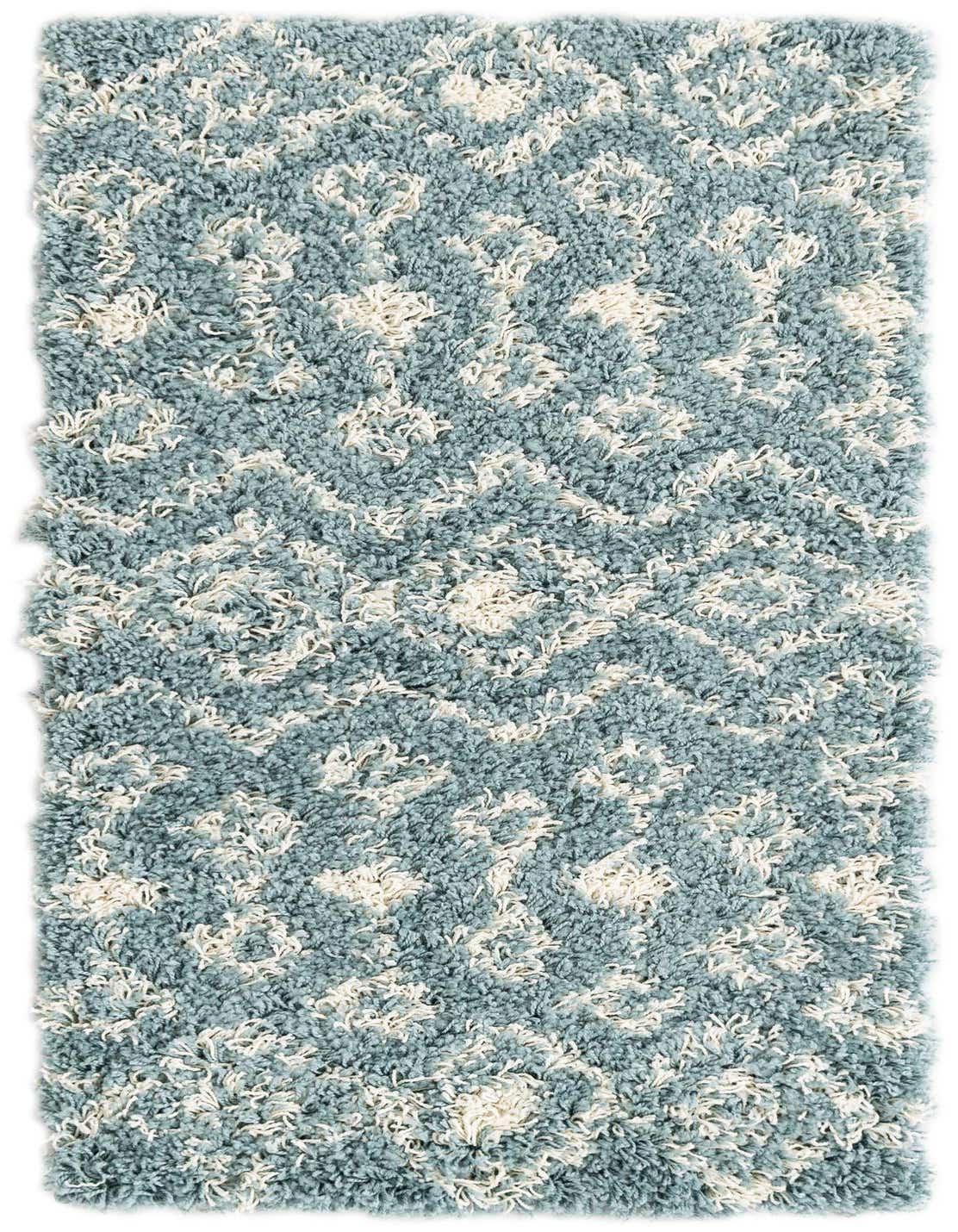 A light blue and cream shag runner rug with a modern Moroccan trellis pattern, perfect for a hallway.