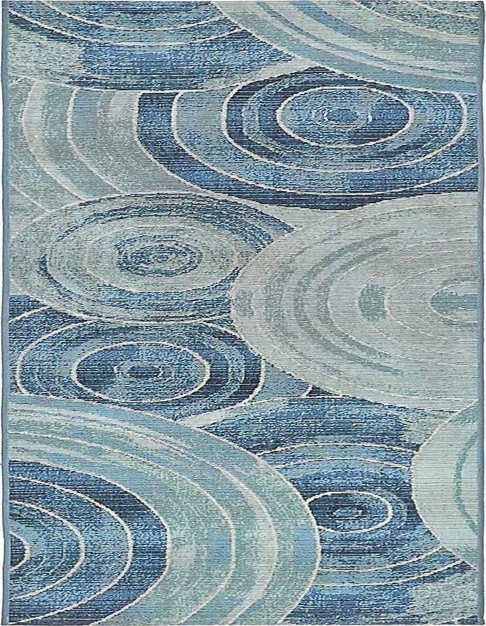 A 6 ft runner rug featuring an abstract coastal pattern with concentric circles in varying shades of blue and light blue, suitable for hallways or patios.