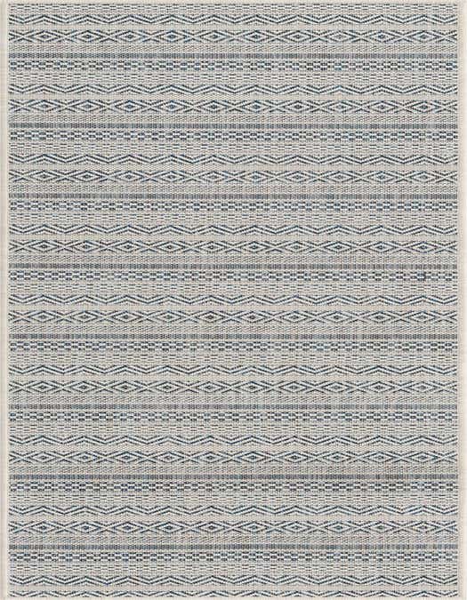A light blue and white tribal pattern runner rug with alternating stripes of geometric designs, suitable for a hallway or patio.
