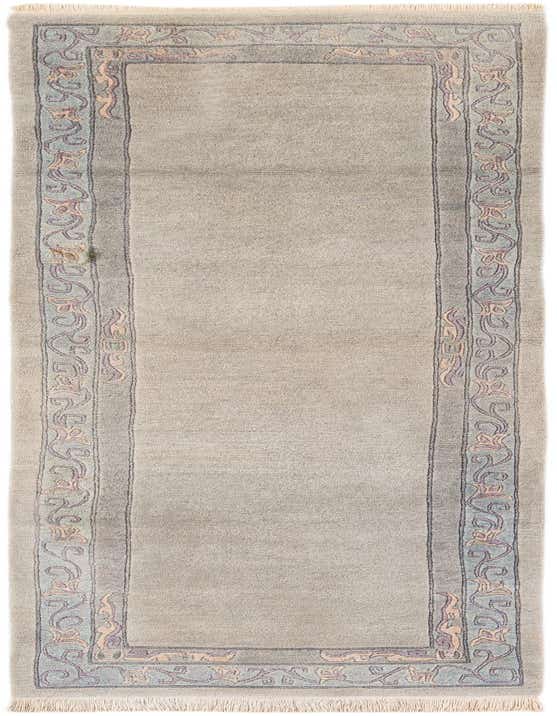 A handmade 11 ft wool runner rug in light blue and beige with an intricate oriental border pattern, perfect for a hallway.