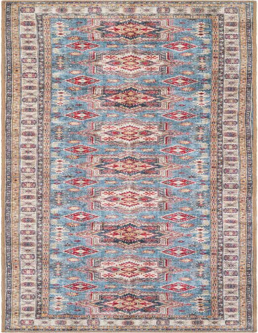A 10 ft runner rug from Rugs.com's Timeless collection, featuring a modern geometric pattern in blues, reds, and creams with a flat, textured pile.