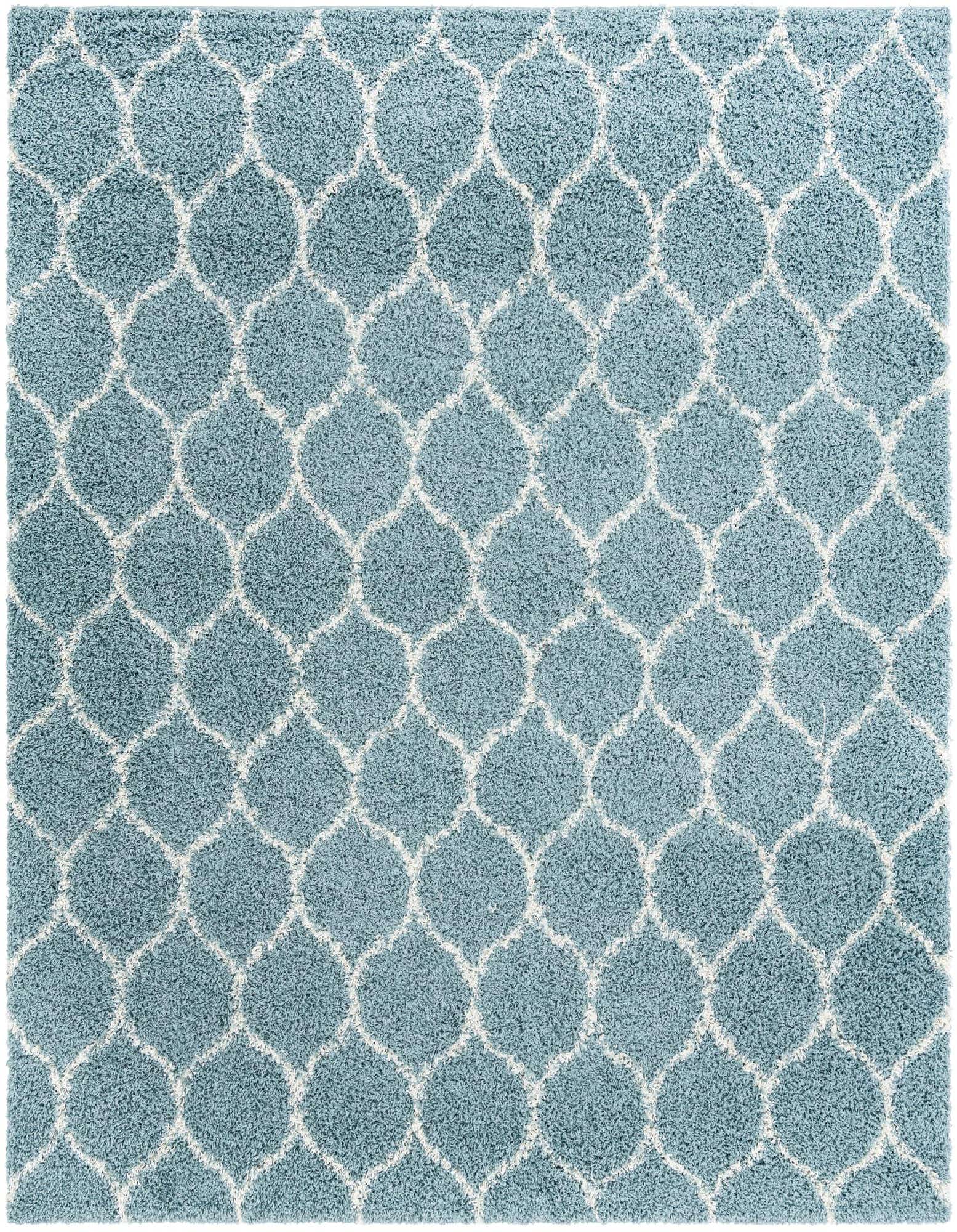 A 10'x10' square light blue shag rug with a white modern lattice pattern, featuring a textured high-low pile.