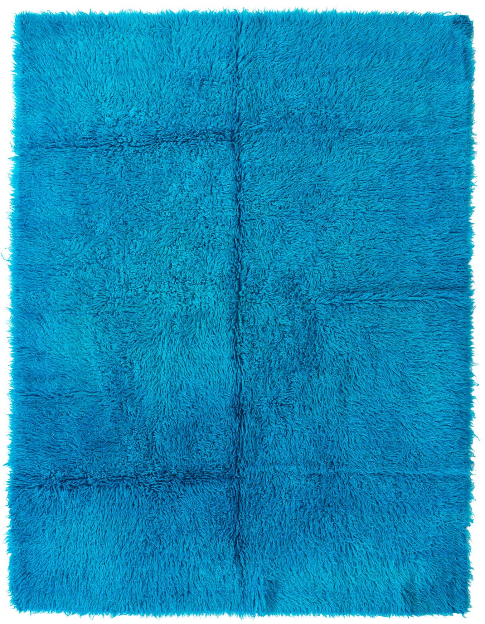 A vibrant 5' 2 x 6' 10 square shag rug in a bright blue hue, featuring a plush, soft texture.