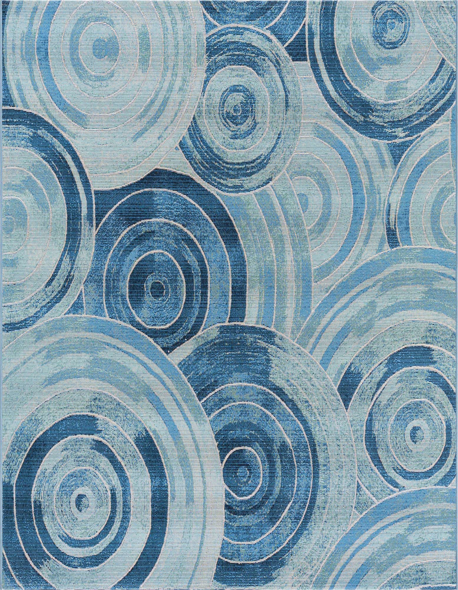 A 6'x6' square indoor/outdoor rug featuring an abstract coastal pattern of concentric circles in various shades of blue.