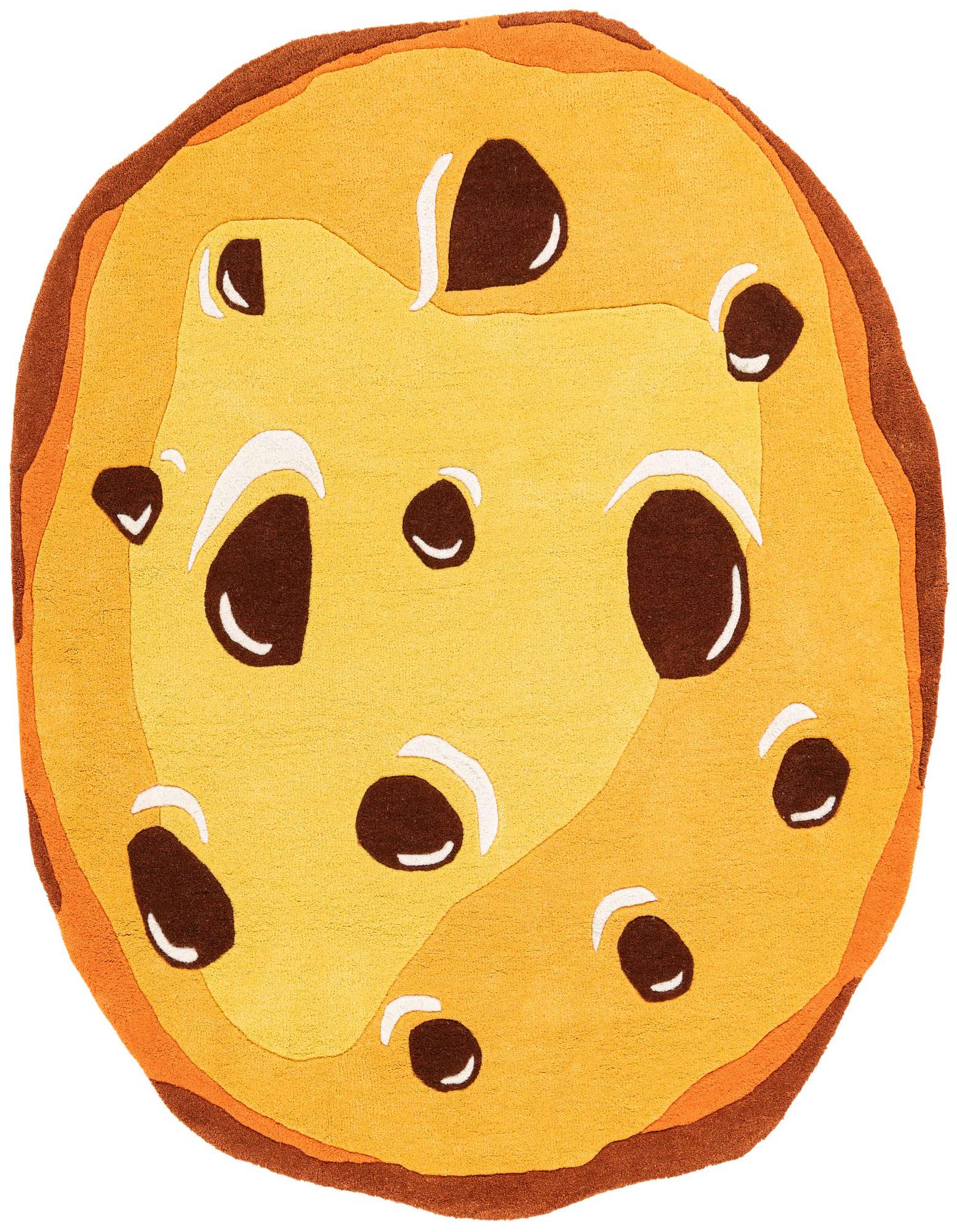 A round, freeform rug designed like a chocolate chip cookie, featuring shades of brown and tan with dark brown 'chocolate chips' and white highlights.