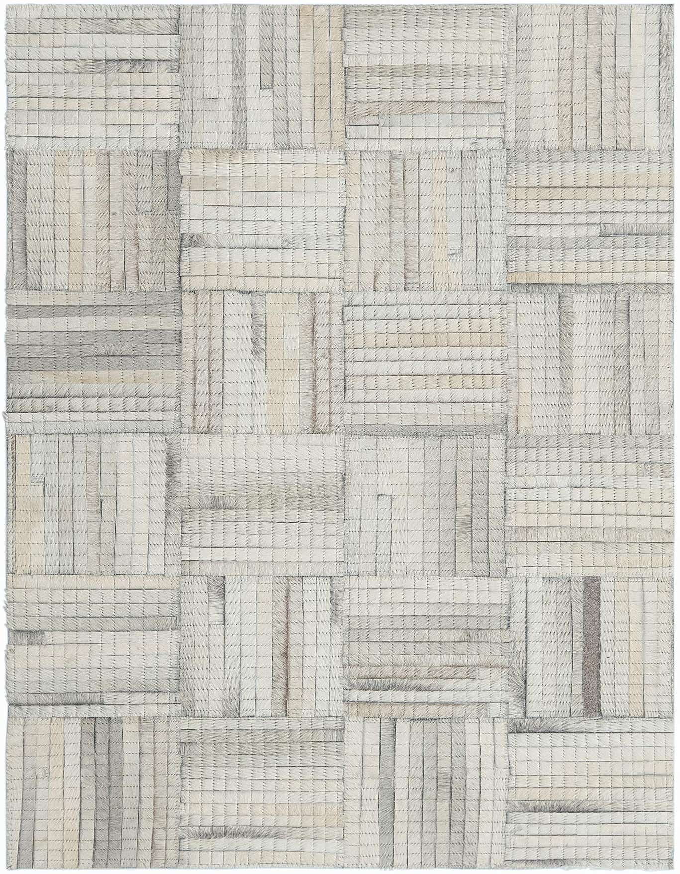 A 2x3 rectangular light brown and ivory modern cowhide and leather rug with an abstract patchwork pattern, suitable for an entryway.