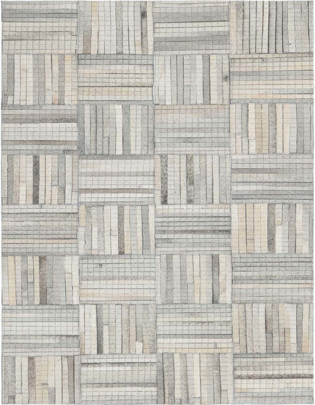 A 4 ft runner rug featuring a modern, abstract patchwork of light brown and ivory cowhide and leather.