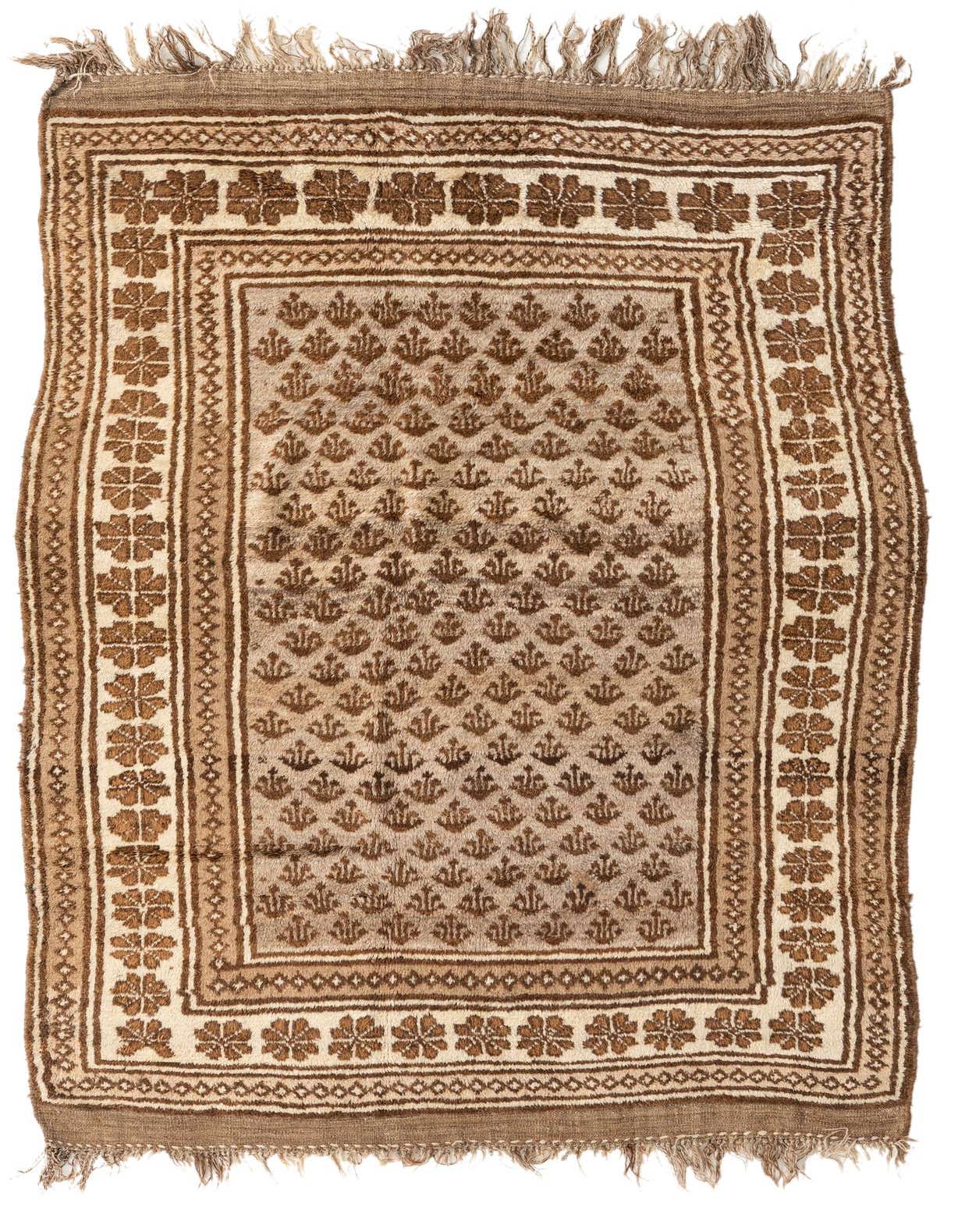 A 5x8 rectangular Balouch wool rug in shades of brown and tan, featuring a tribal floral pattern and thin pile.
