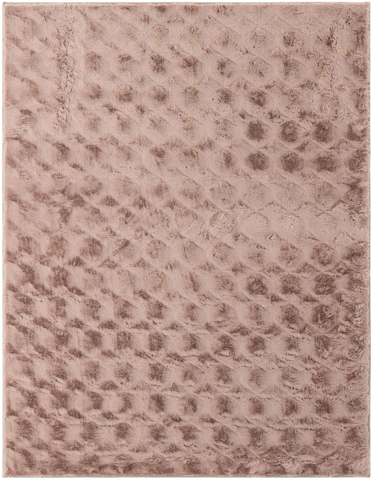 A 5x7 rectangular brown area rug with a modern, solid pattern featuring carved circular textures.