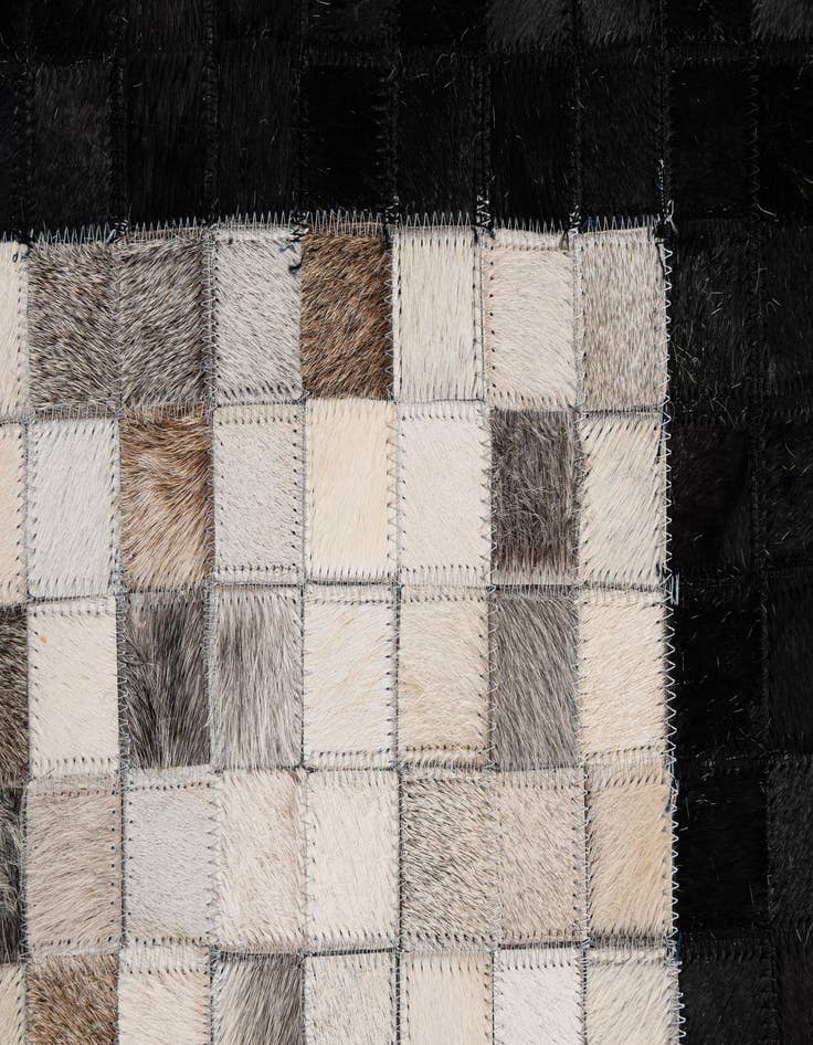 Detail image of  4' 11 x 7' 10 Cowhide - Patchwork Rug