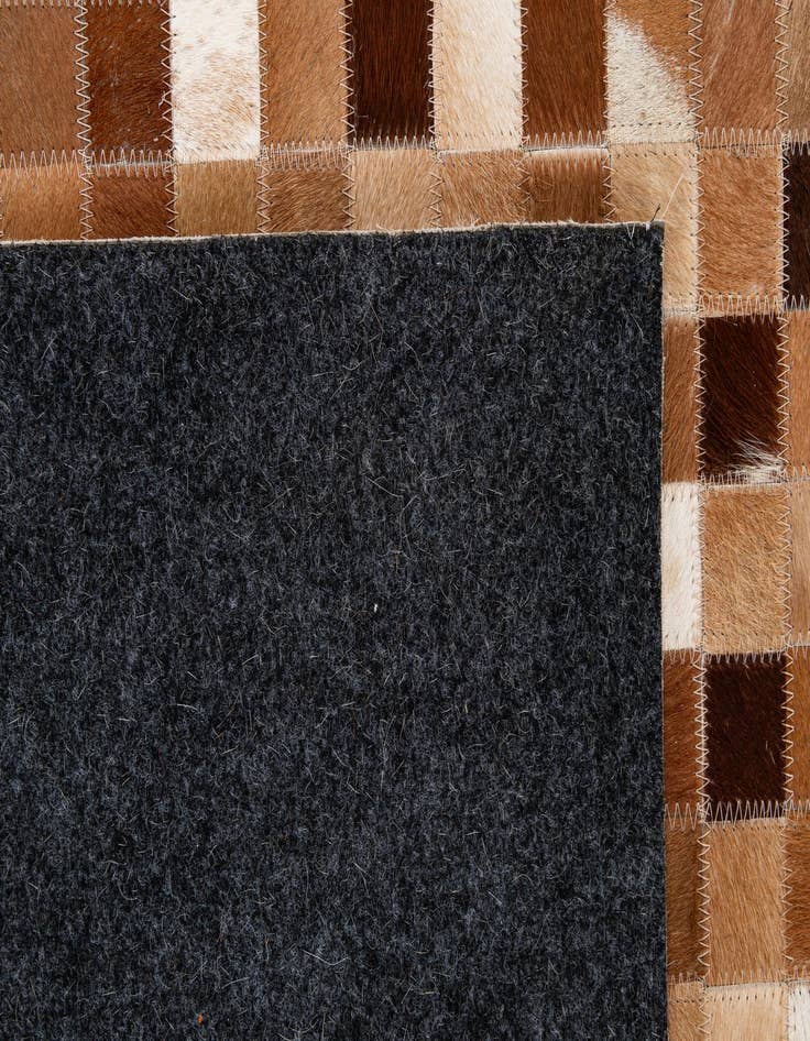 Detail image of  5' 1 x 7' 11 Cowhide - Patchwork Rug