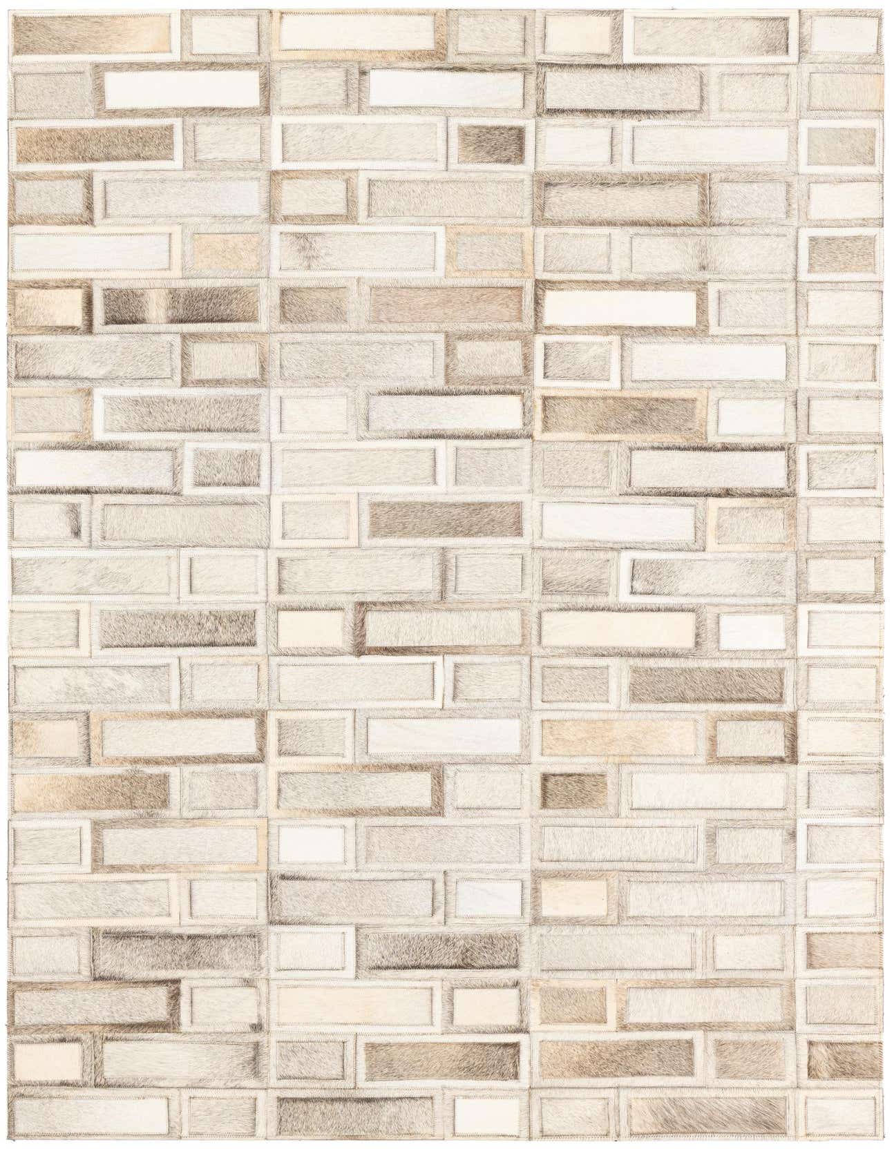 A 4x6 rectangular rug featuring a modern patchwork of varied brown and tan cowhide and leather rectangles.