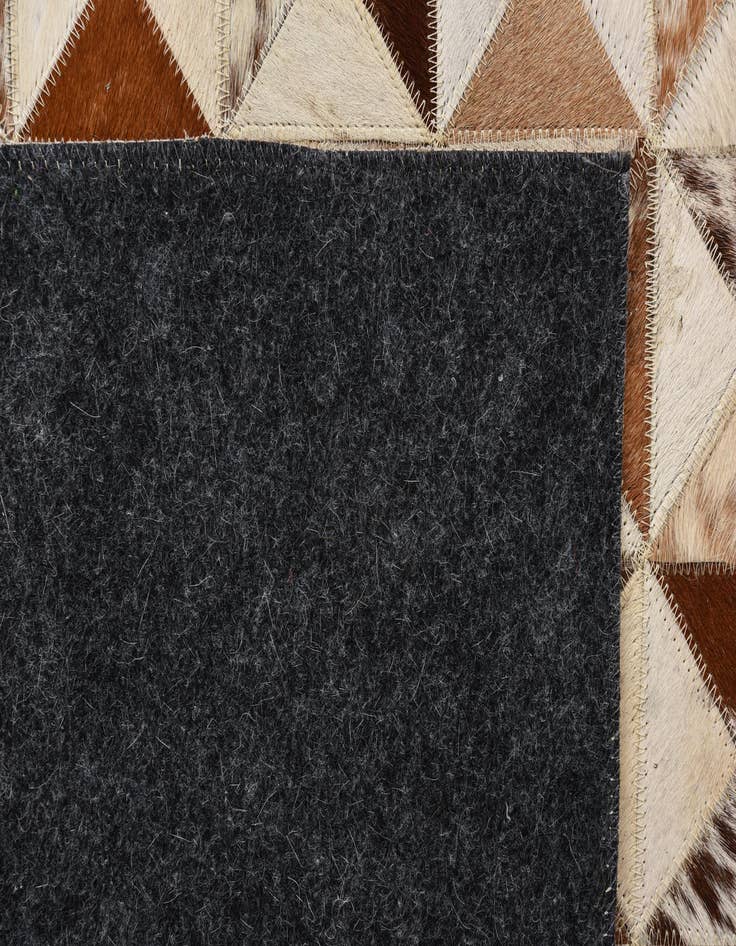 Detail image of  5' 4 x 7' 7 Cowhide Rug