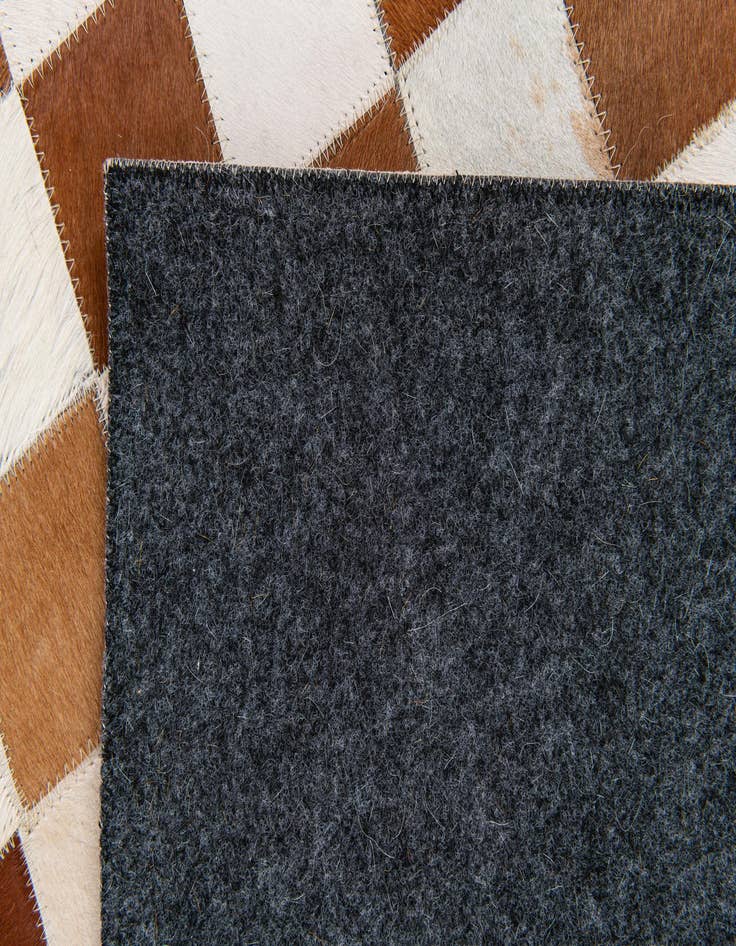 Detail image of  5' x 7' 11 Cowhide Stocks Rug
